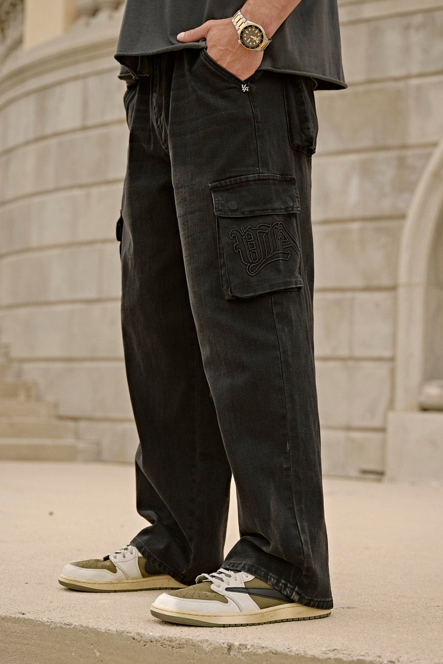 Front and side view of baggy cargo jeans on a model