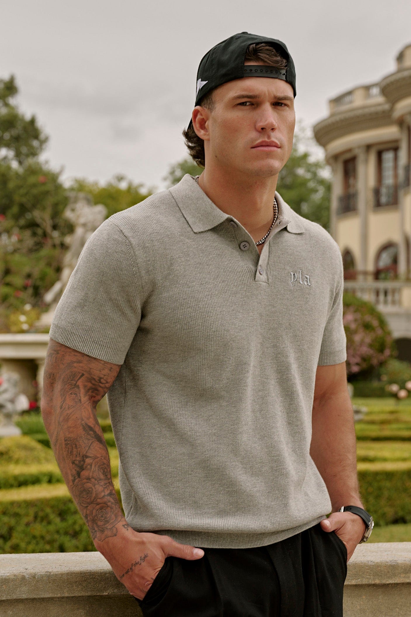 Model wearing a tailored knit polo with chinos for a polished look