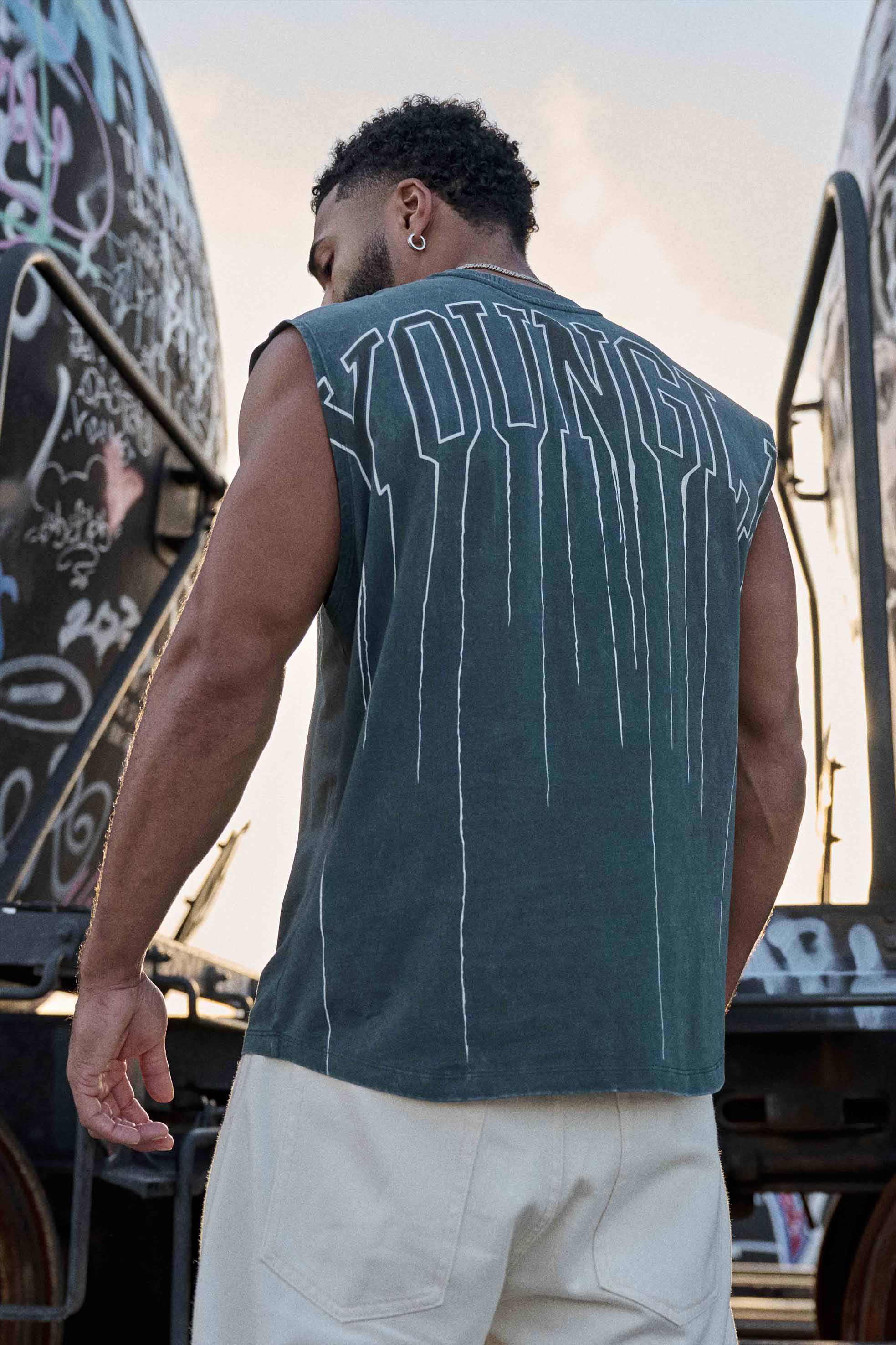Back view of the muscle tank showing the drip print design