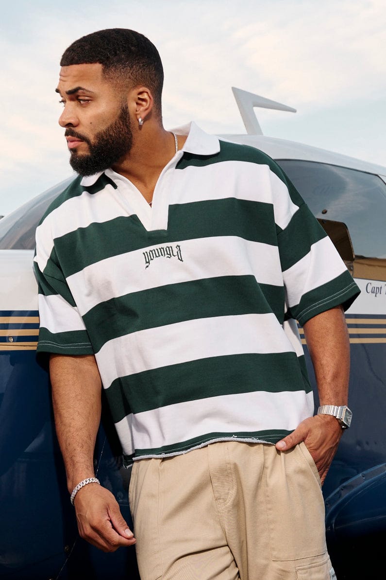 Front view of oversized polo shirt in bold stripes, casual style