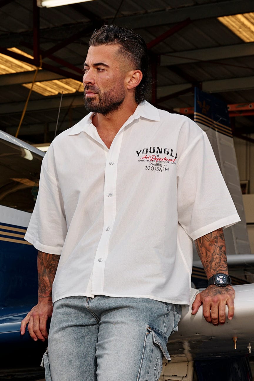 Detail shot of the shirts subtle graphic, highlighting its vintage mechanic tee inspiration.
