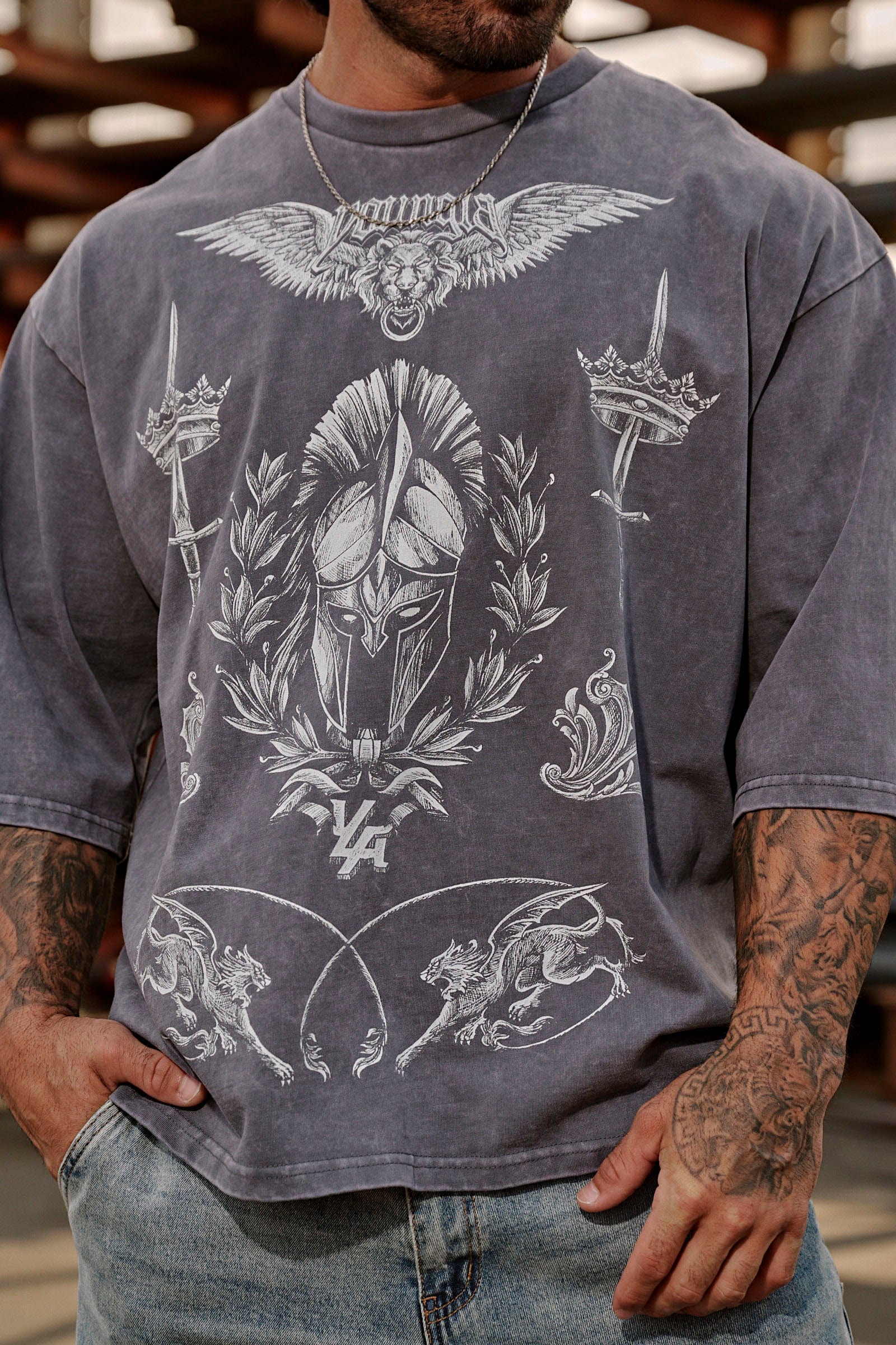 Side angle of oversized t shirt women styled with jeans, highlighting relaxed drape.