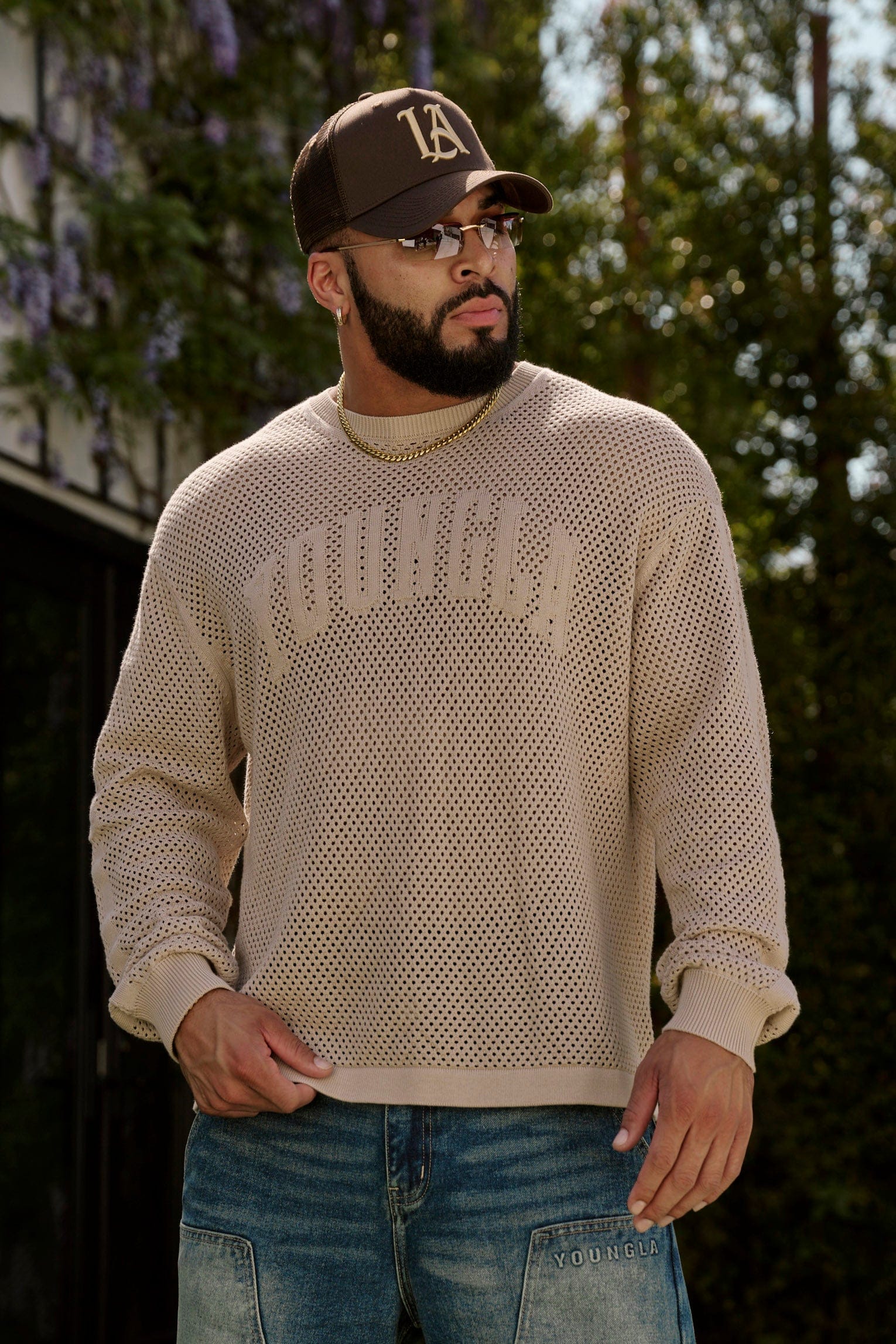 Model wearing YoungLA 99 Knit Long Sleeve T-Shirt in a relaxed setting.