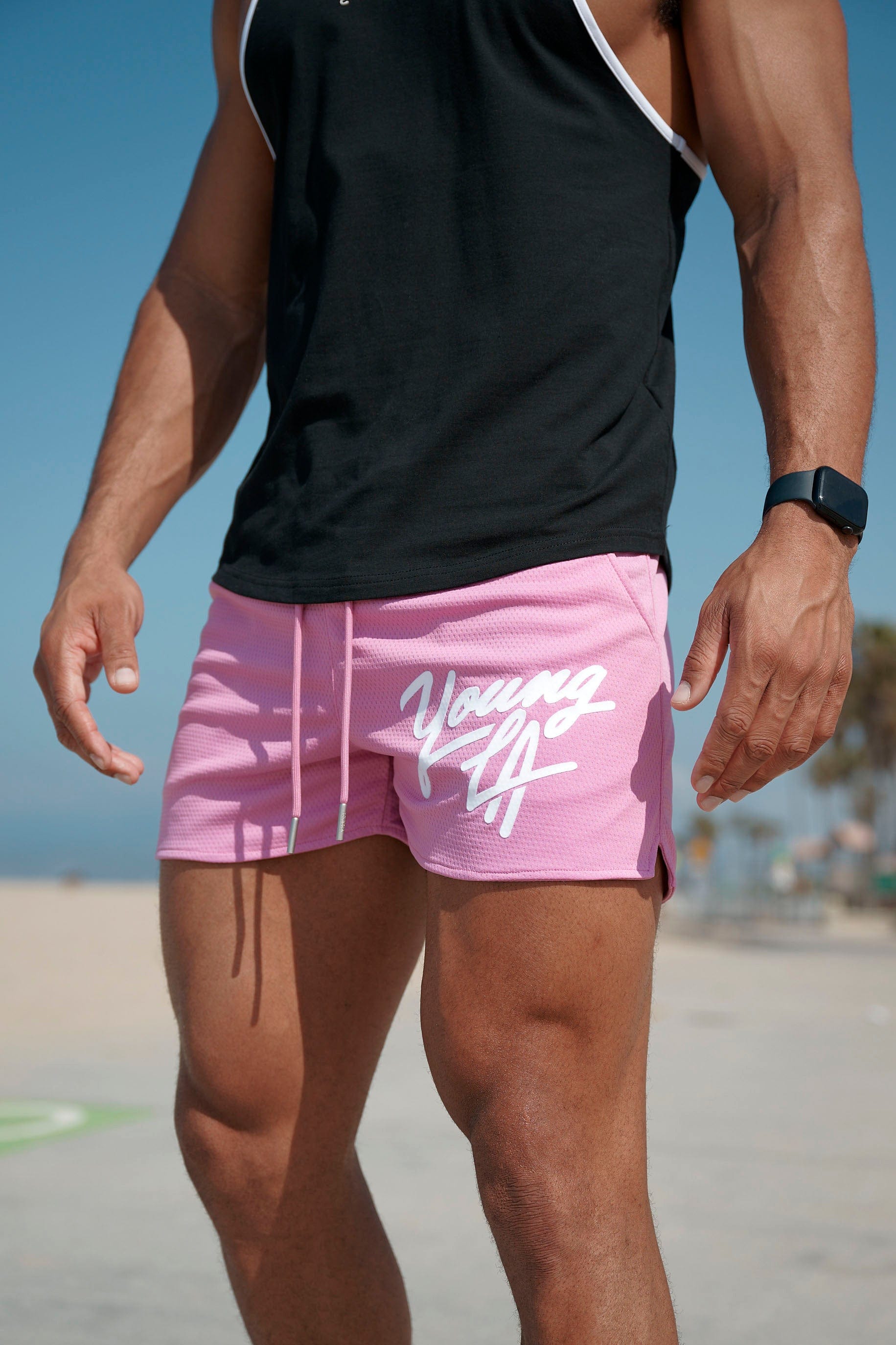 Gray mens workout shorts on hanger showing waistband detail