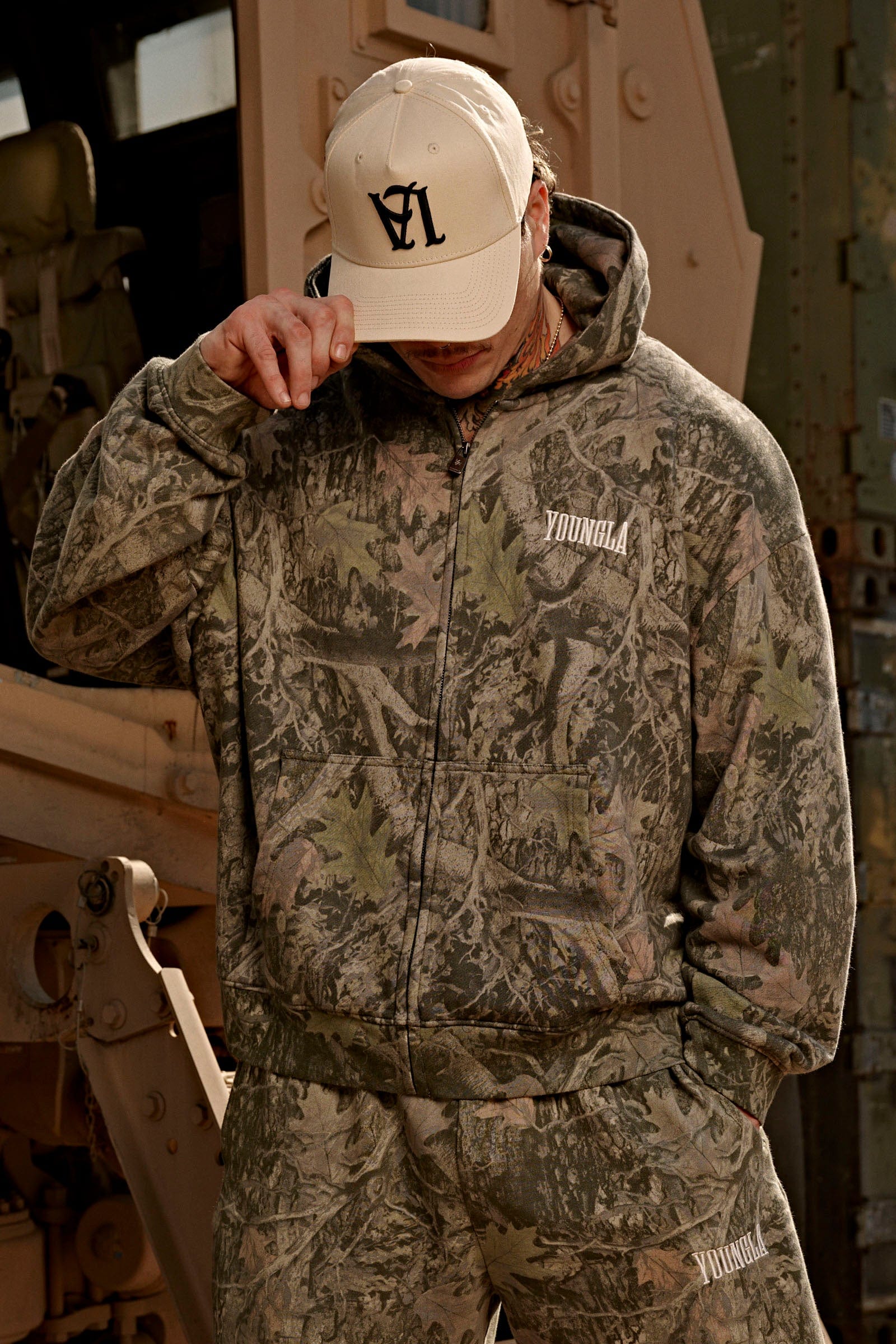 Side view of the black zip-up hoodie, perfect for casual outings.