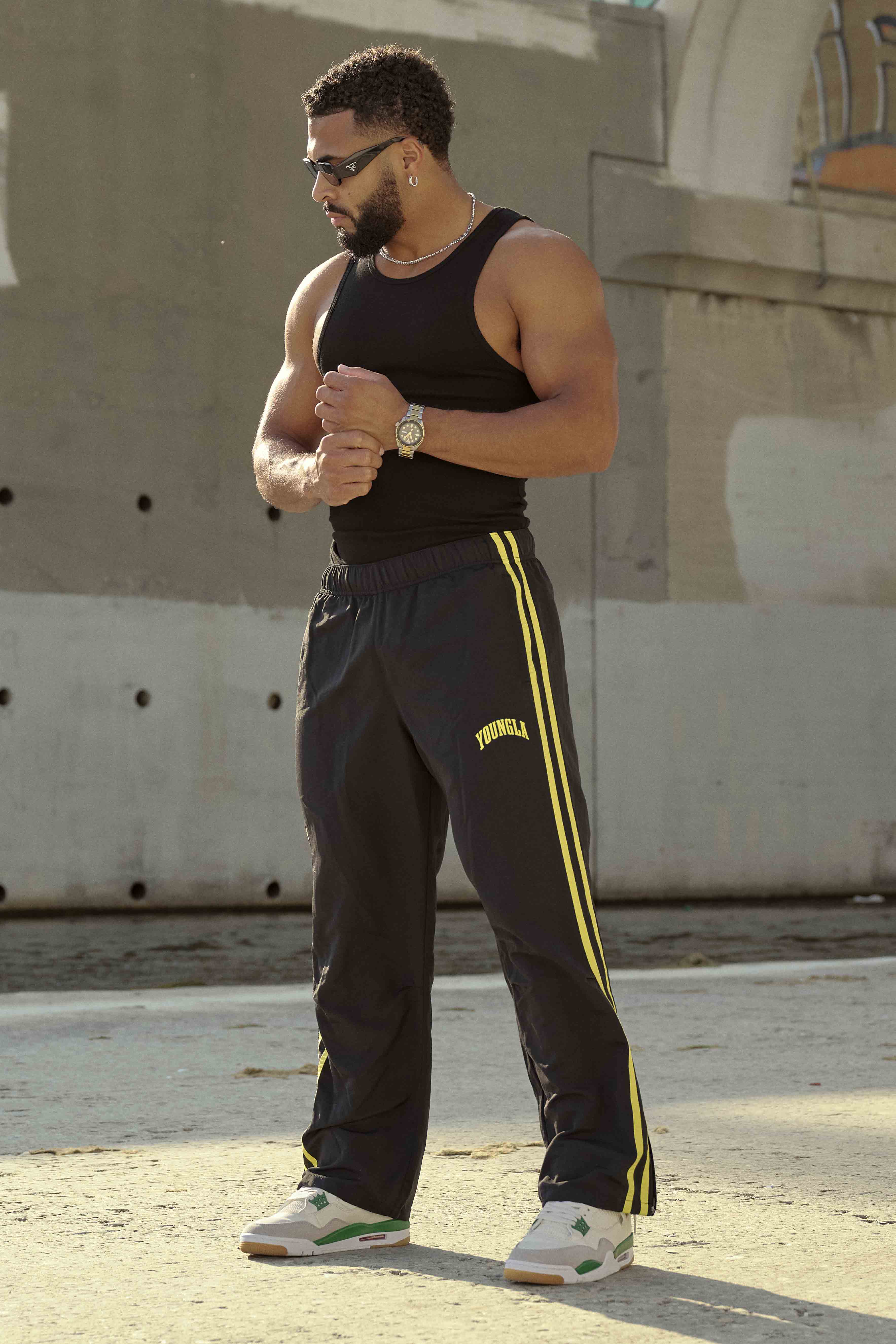 Model wearing black joggers, perfect for casual outings or lounging.