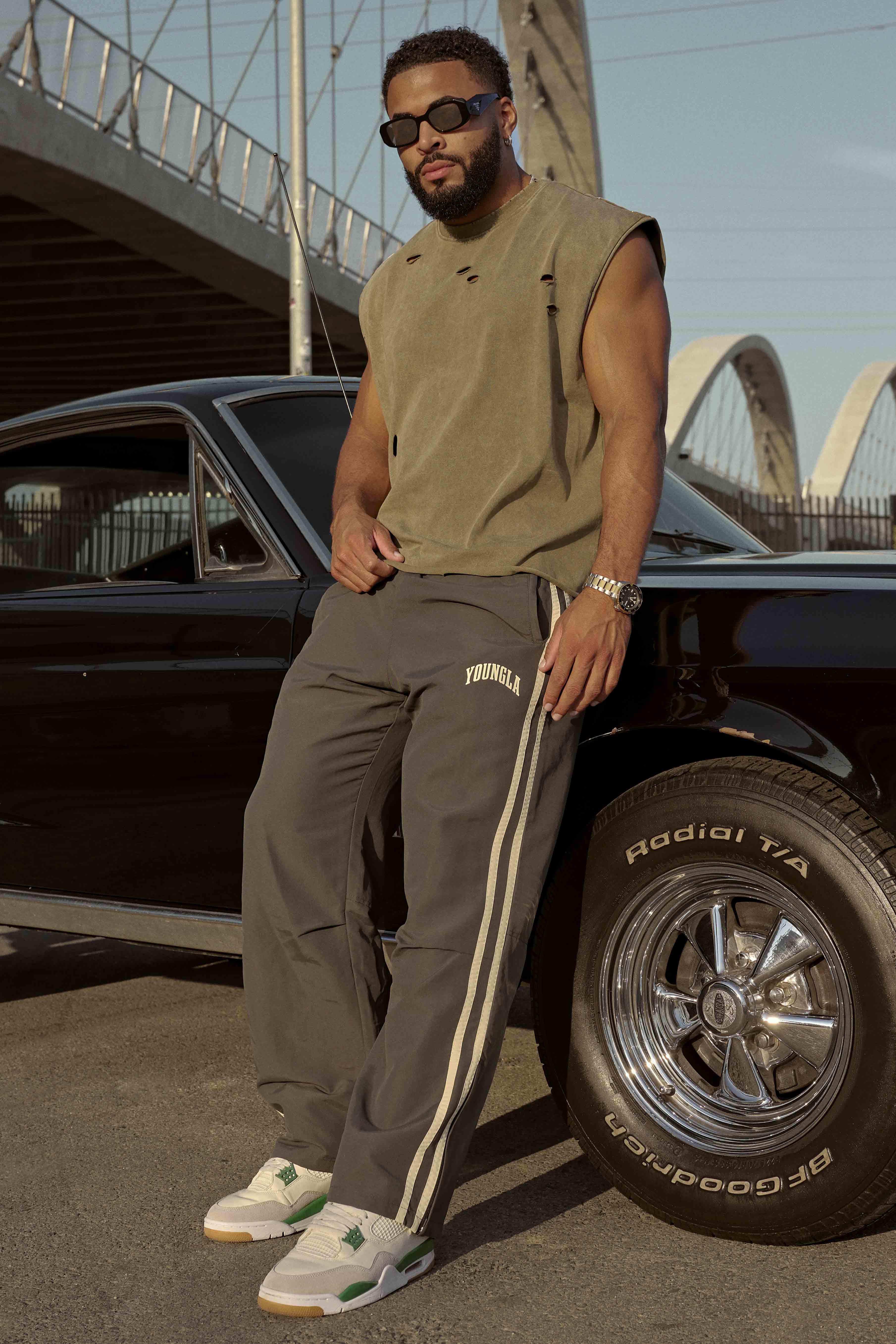 Model wearing black joggers, perfect for casual outings or lounging.