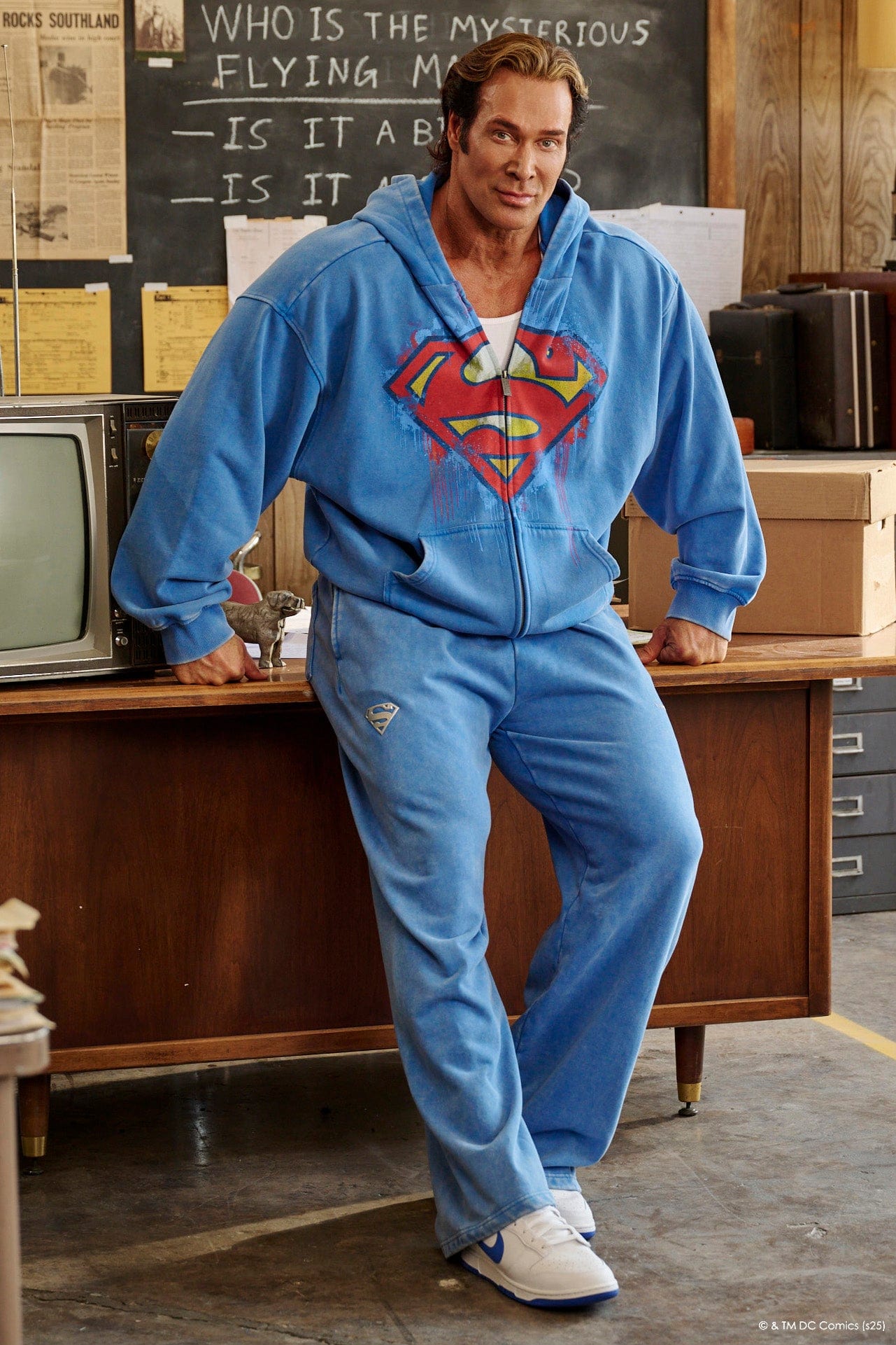 Model wearing Superman sweats in a casual streetwear outfit