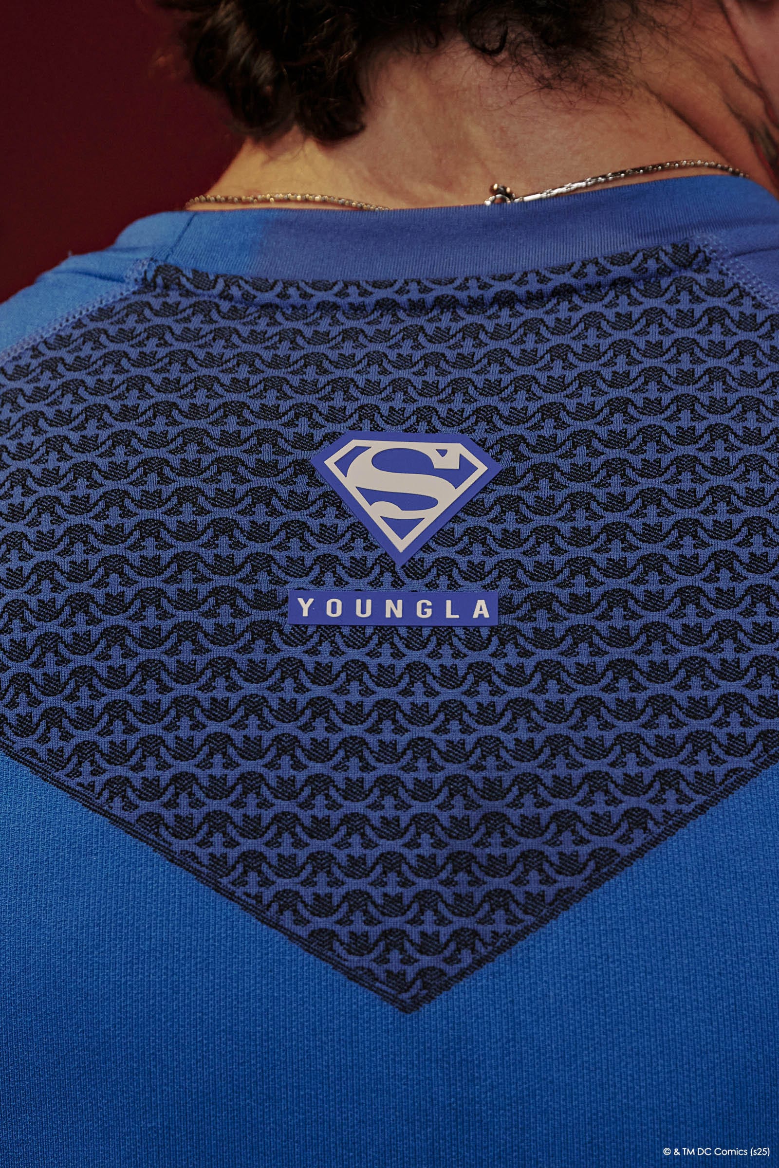 Close-up of the Superman compression shirt’s jacquard pattern and stitching.