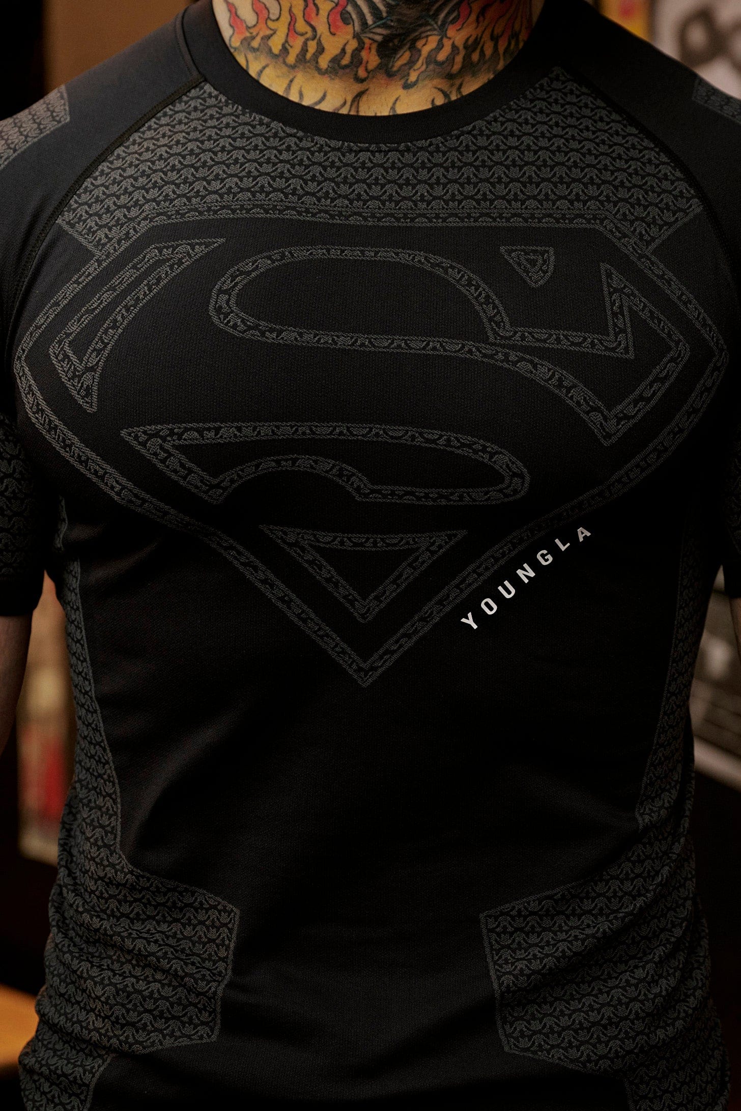 Athlete wearing the compression tee during a workout, highlighting flexibility.