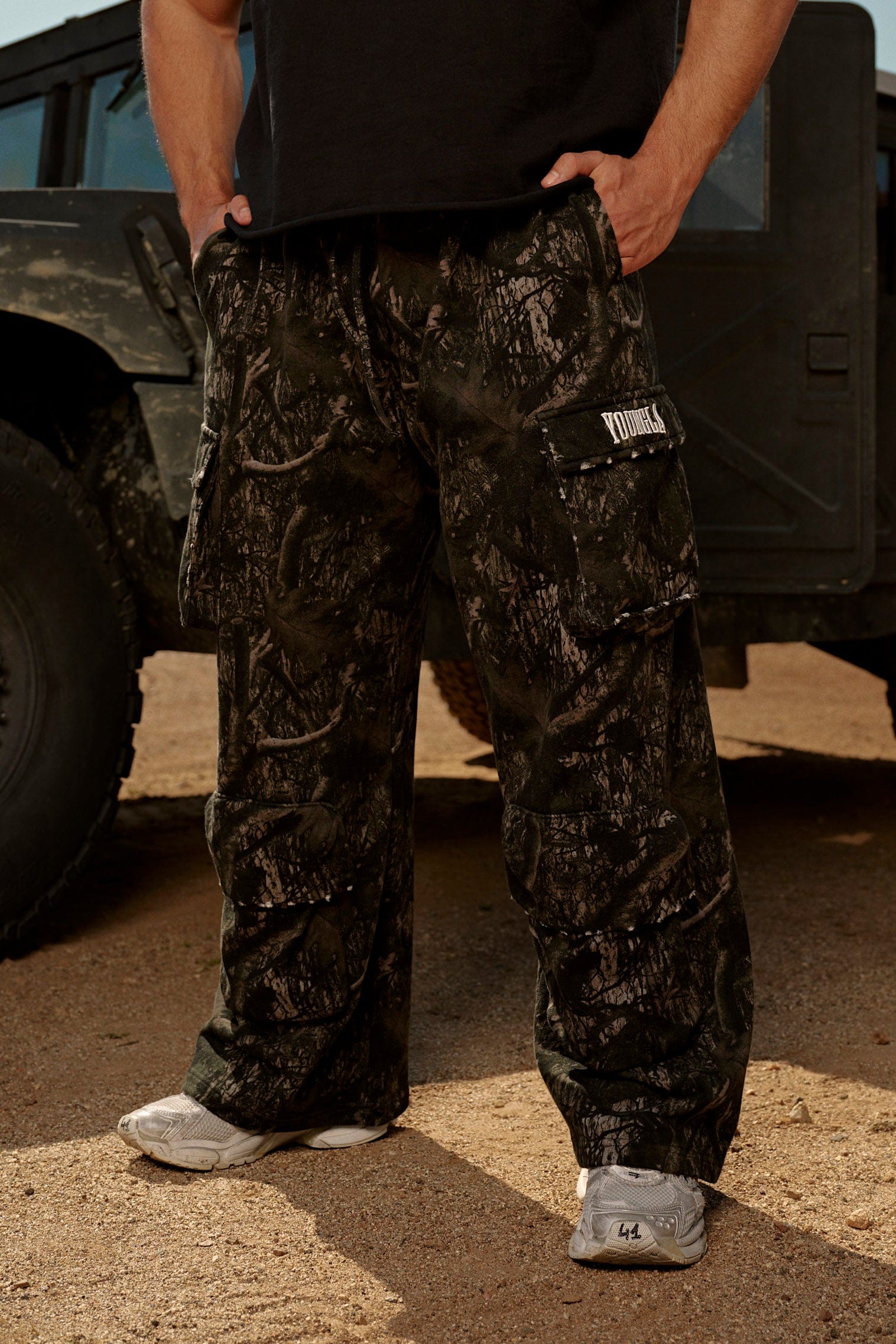 Side view of heavy cotton cargo sweatpants in camo design.