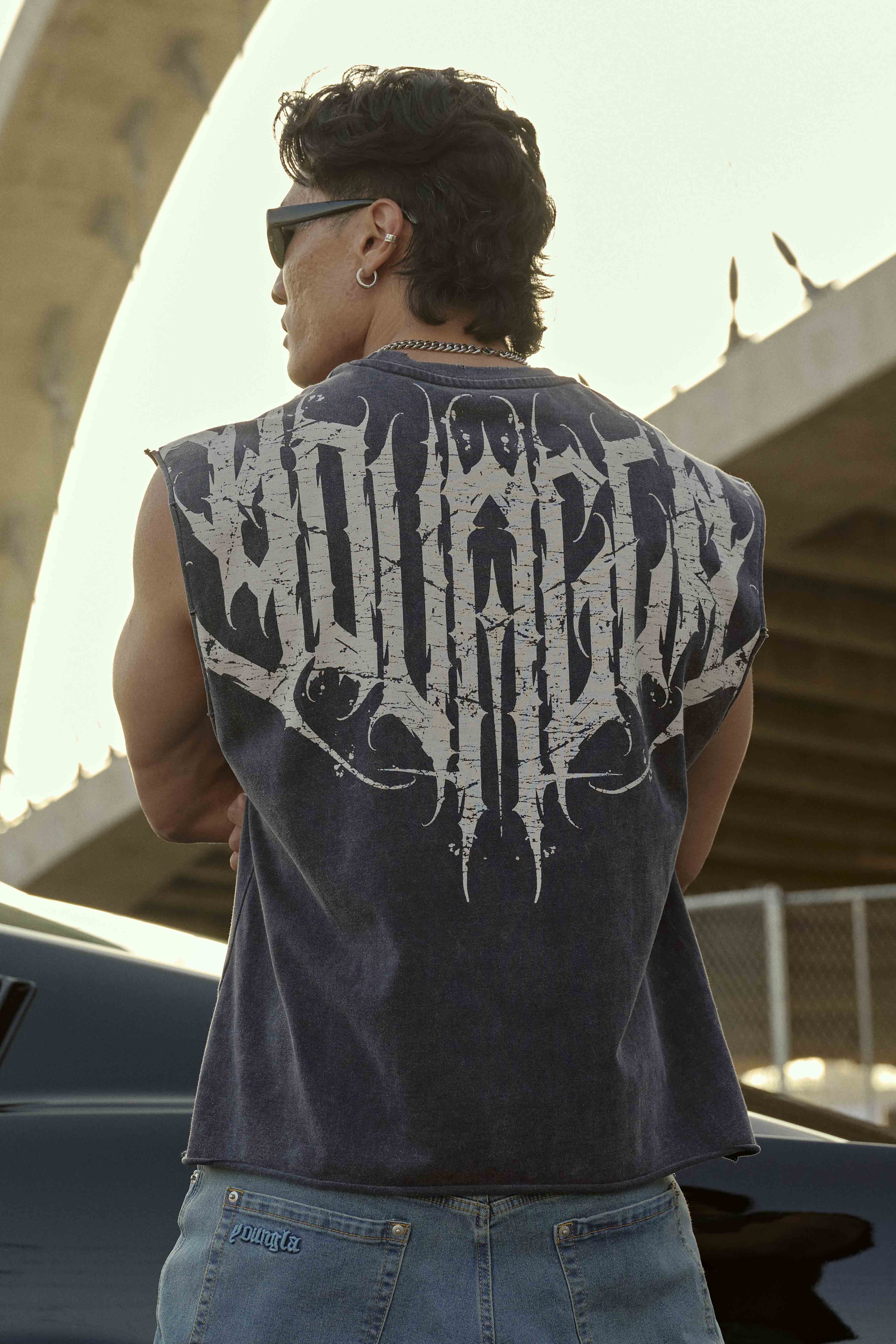 Model wearing the Anarchy Edge Crop Tank Top in a casual setting.