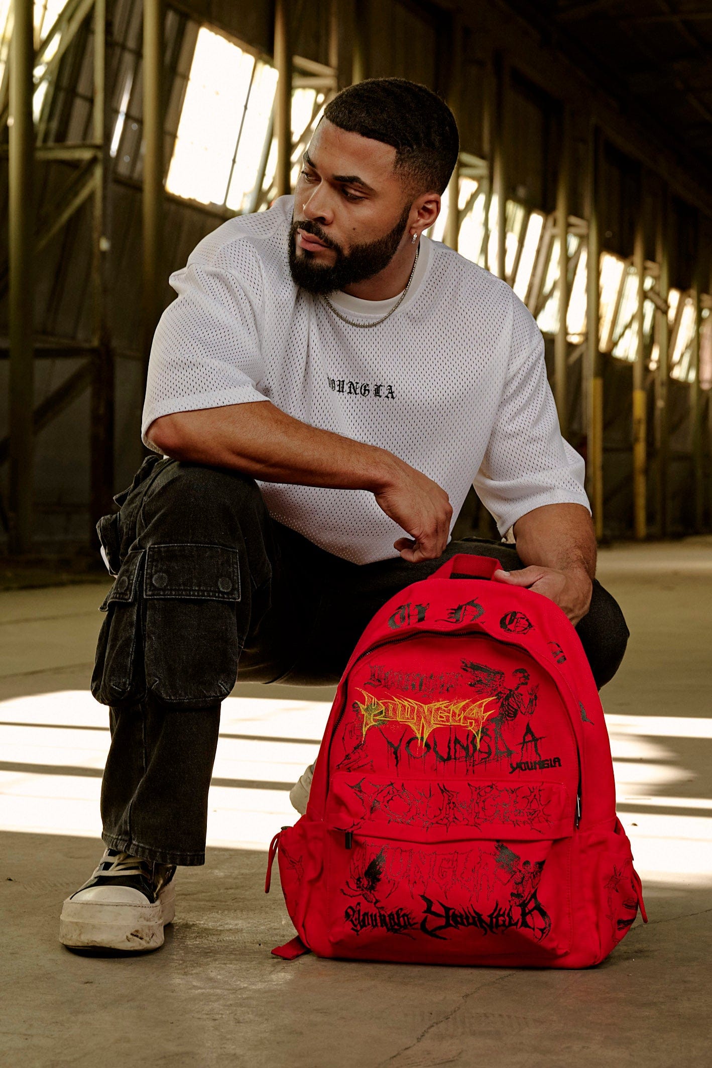 Side view showing adjustable pockets of canvas backpack