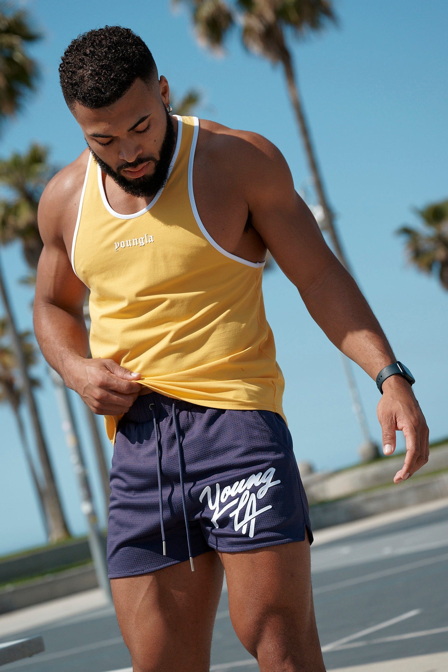 Side profile view showing pocket placement on womens workout shorts