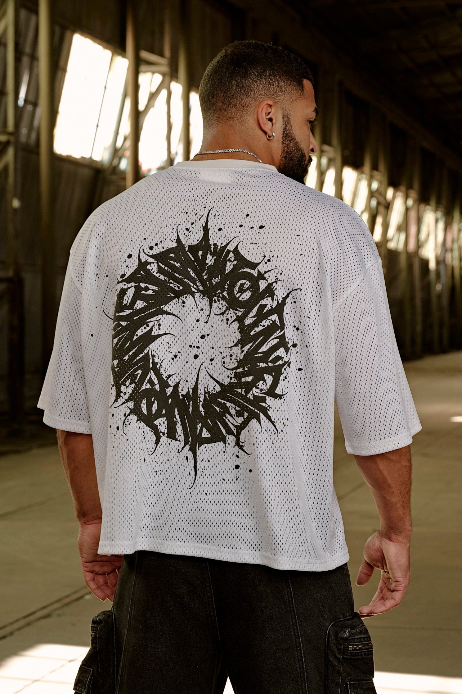 Close-up of relaxed fit bike jersey showing mesh texture.