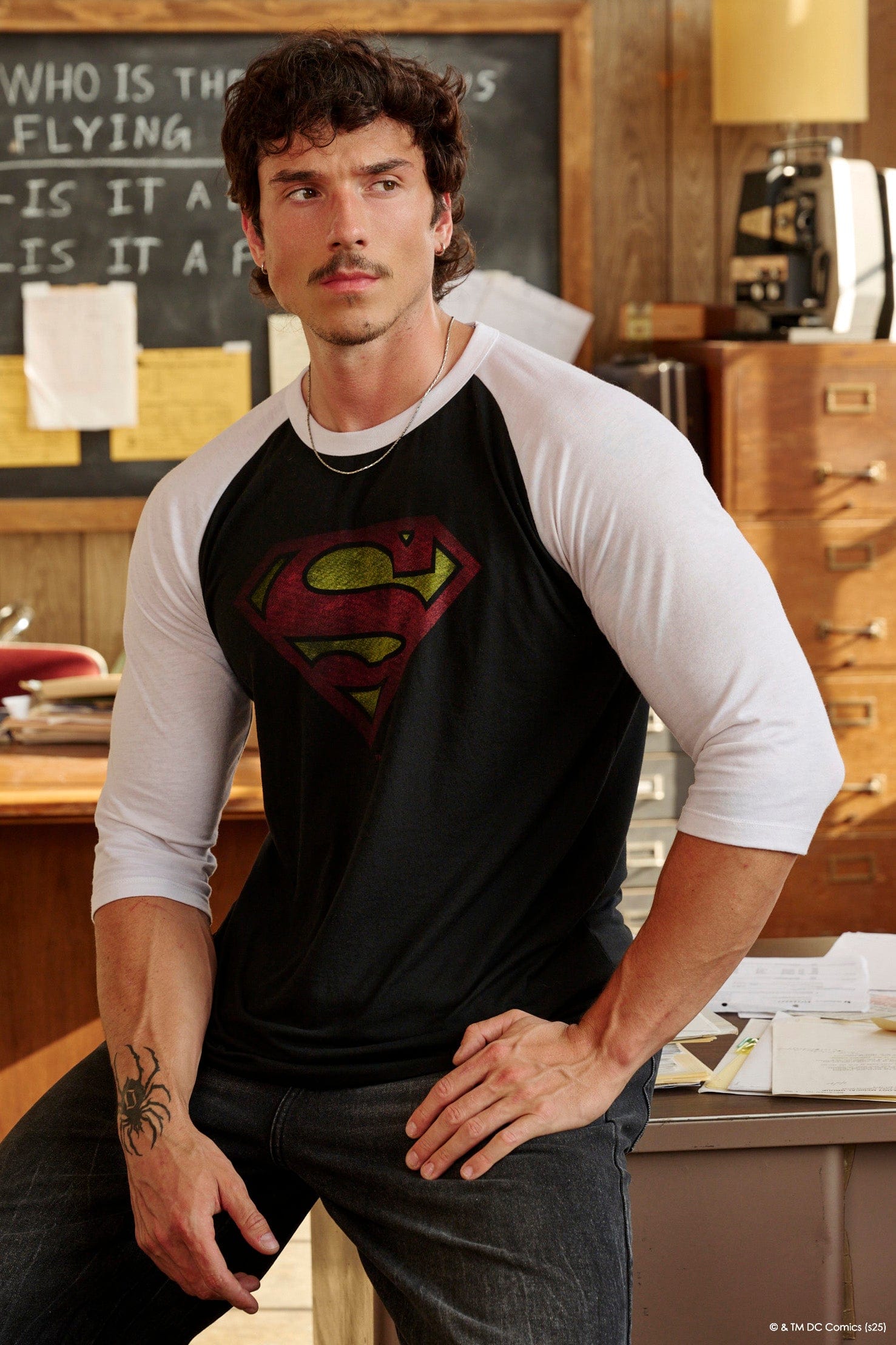 Model showcasing the fitted design of the Superman compression shirt.