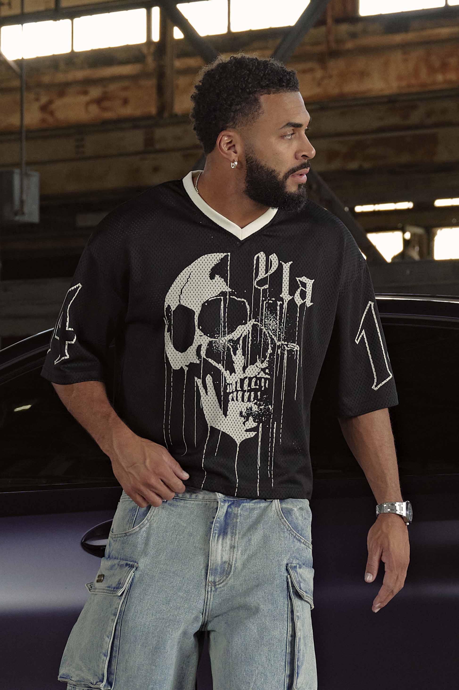 Front view of the drippy skull jersey showcasing bold design and relaxed fit