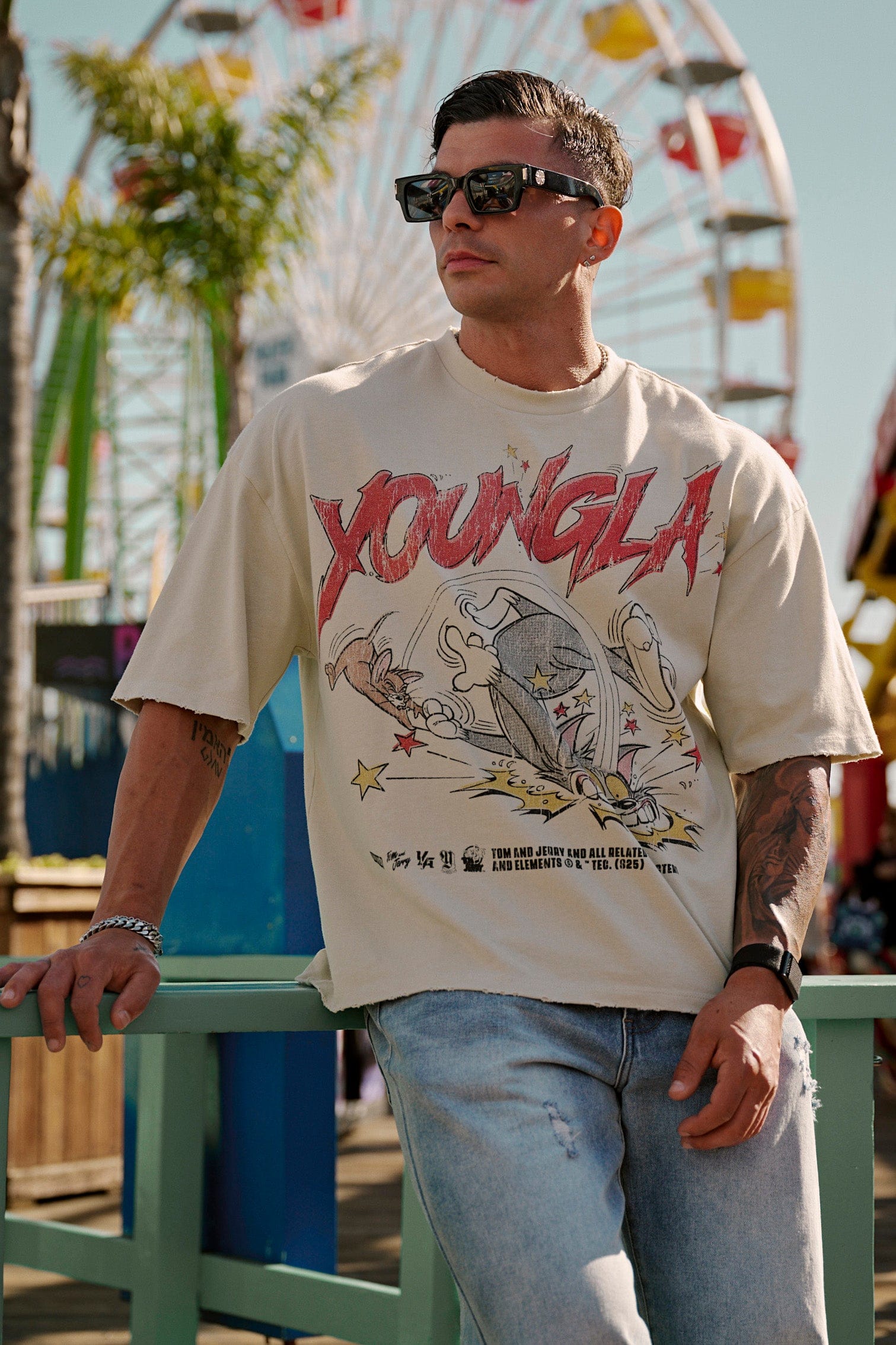 Front view of oversized Tom & Jerry graphic T shirt with bold cartoon print
