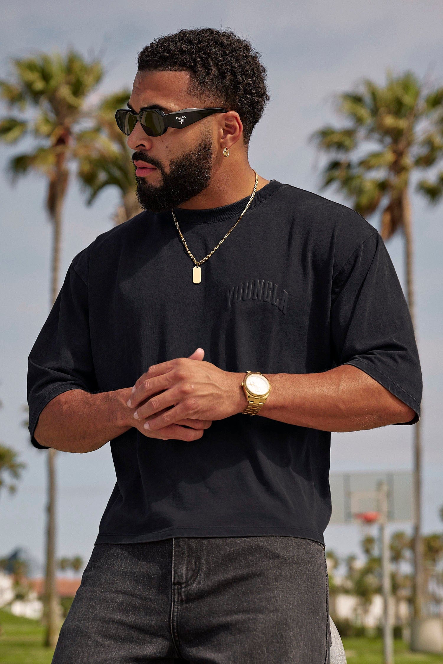 Close-up of the boxy cropped tee’s puff print logo on black fabric