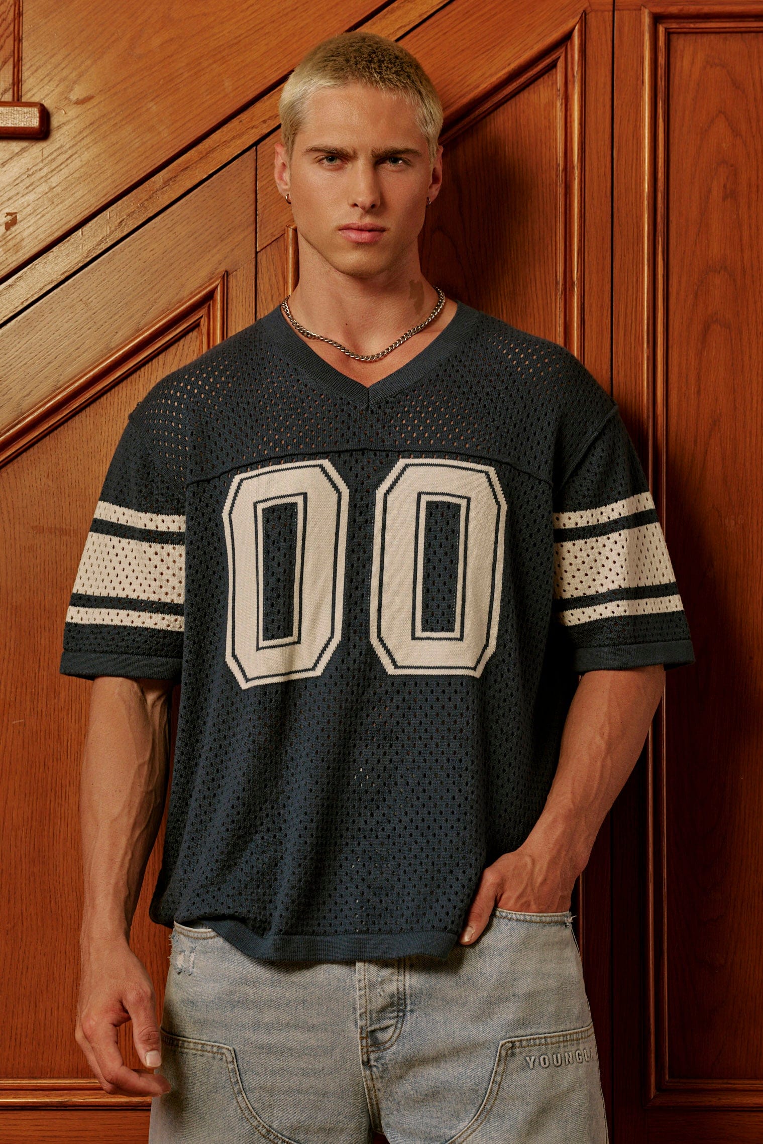 Front view of varsity knit jersey with stripes and varsity number