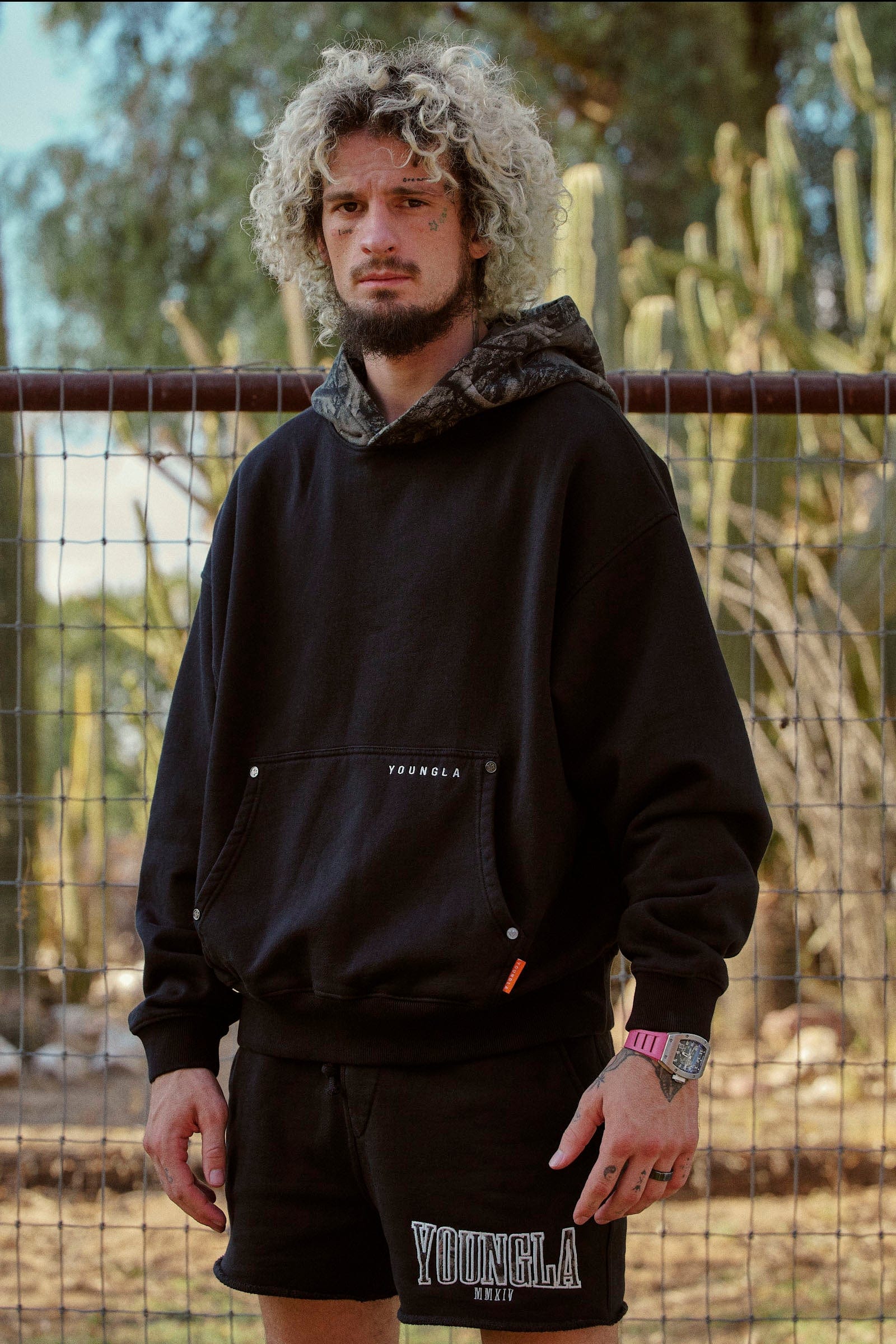Front view of the tree camo hoodie, showcasing its relaxed fit.