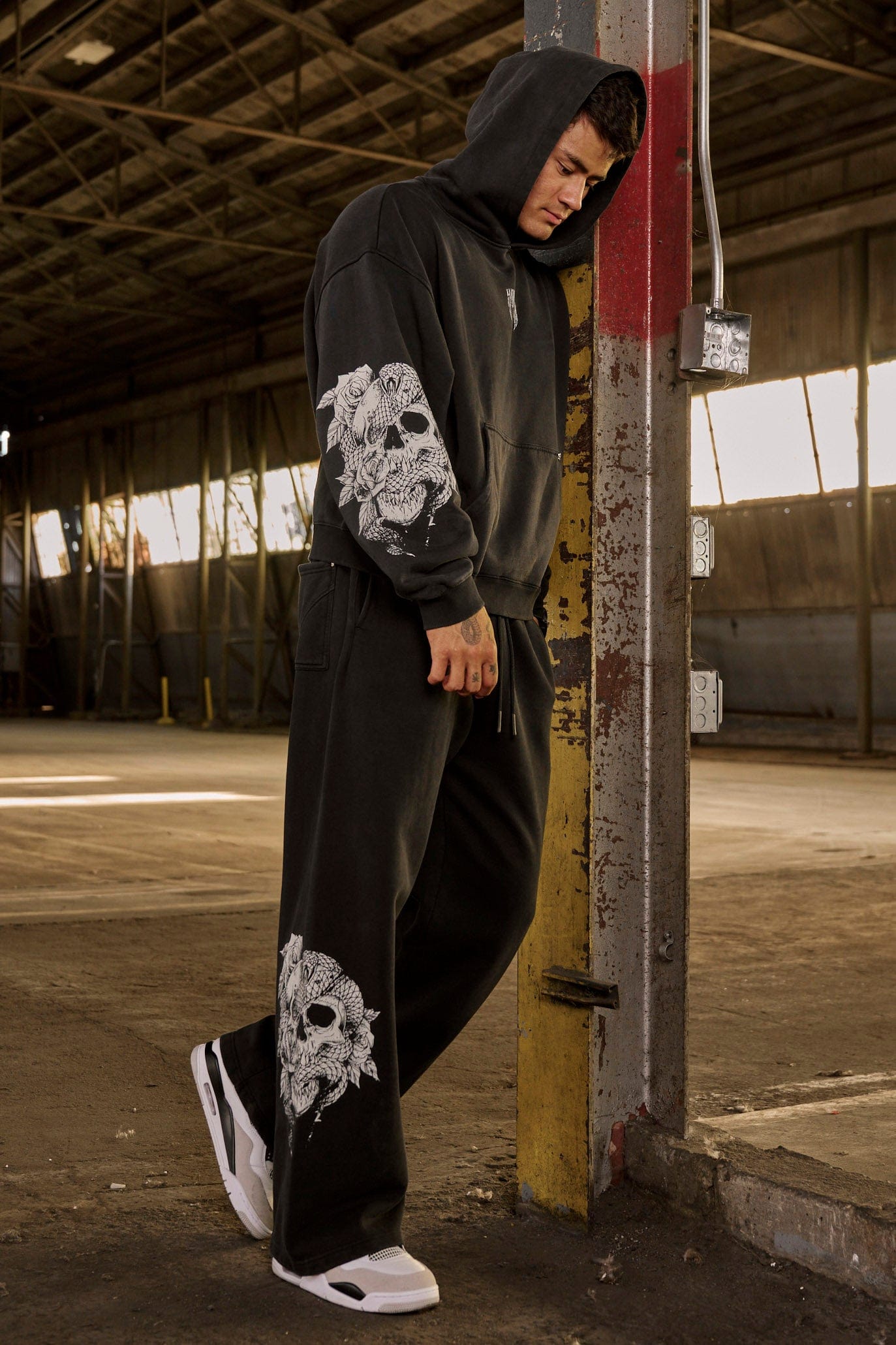 Close-up of the elastic waistband on the graphic sweatpants.