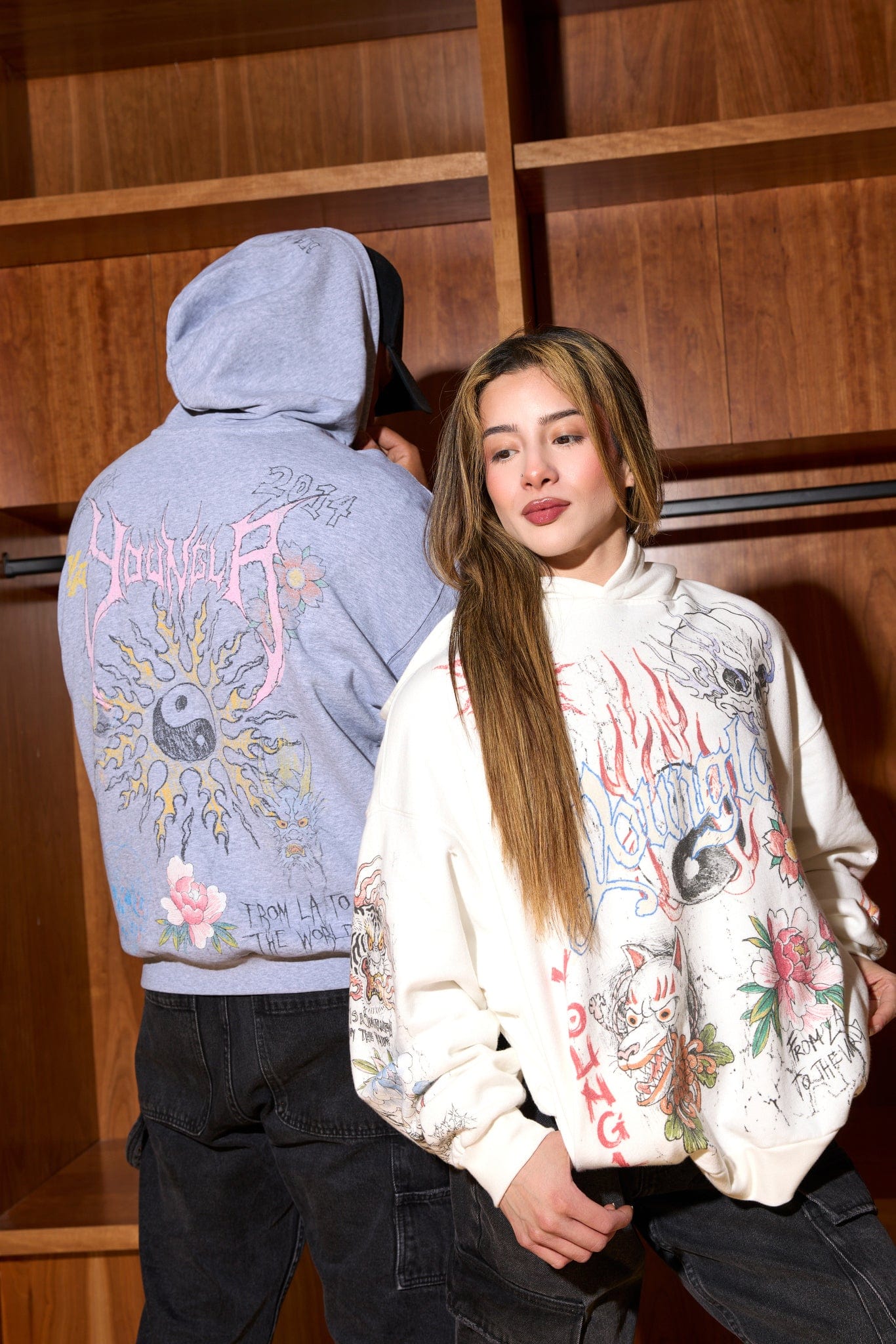 Front view of oversized hoodie in flame-red with streetwear-style ink illustration
