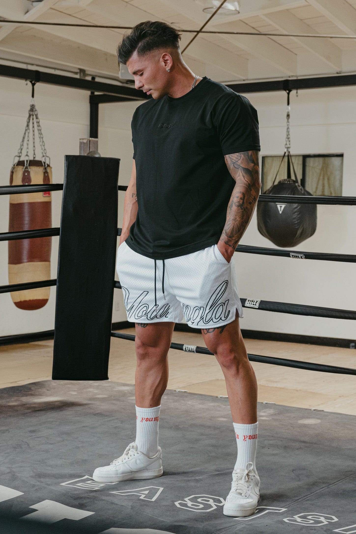 YoungLA mesh gym shorts in black, showing side pocket detail