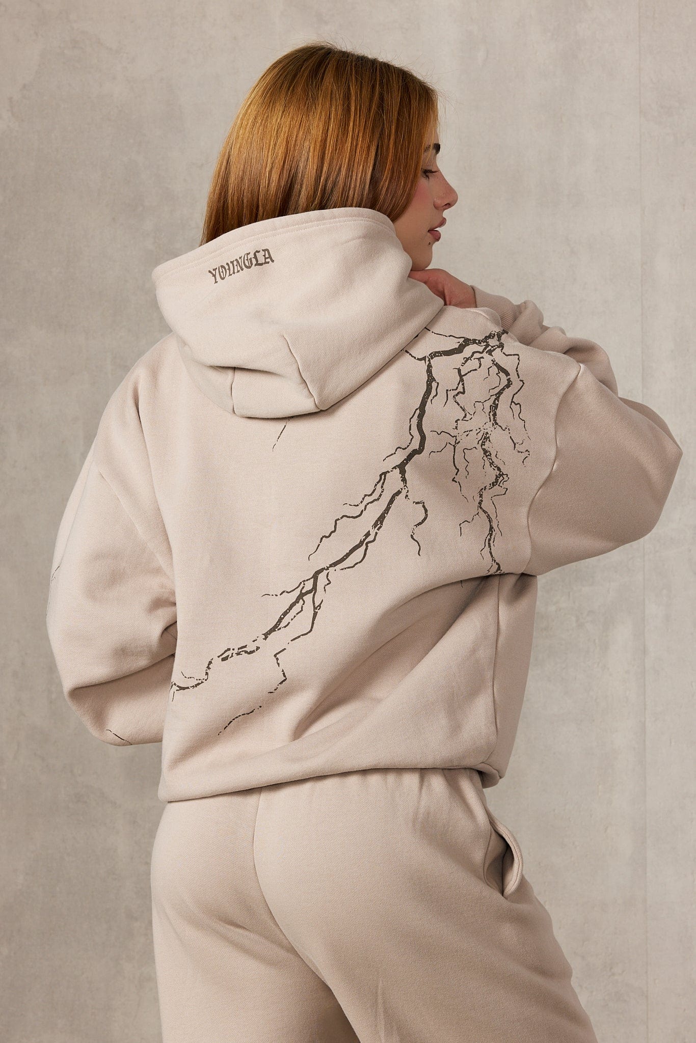 Model wearing the oversized hoodie mens style with joggers for a casual winter look
