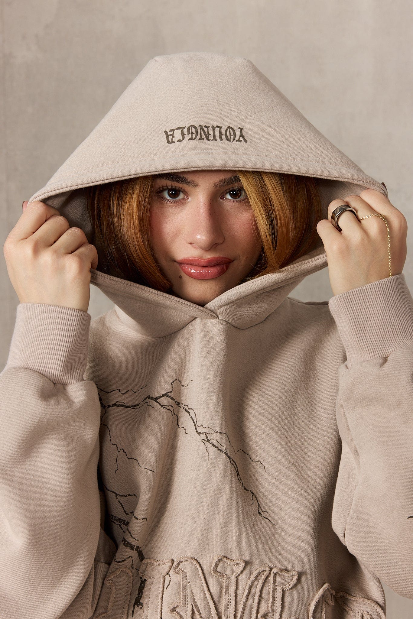 Close-up of the YoungLA oversized hoodies lightning print and zip-up design