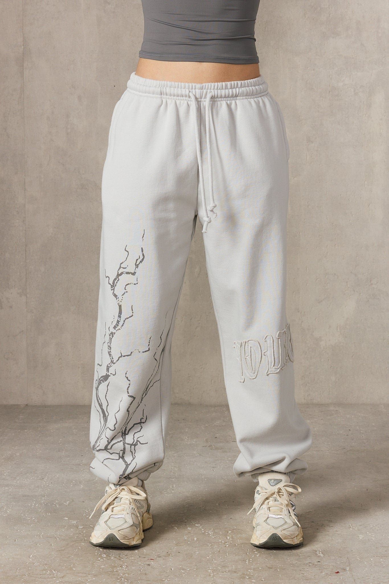Front view of oversized cuff joggers with lightning design.