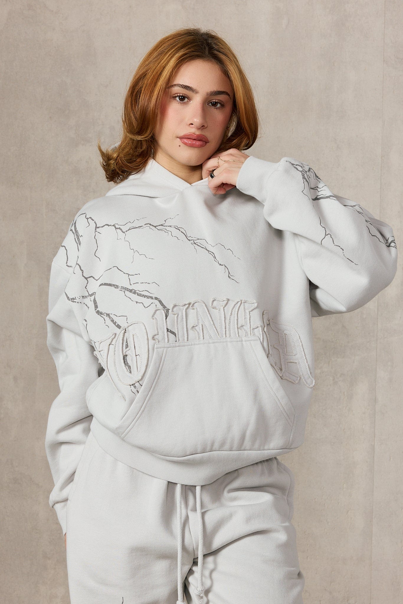 Model wearing the oversized hoodie mens style with joggers for a casual winter look