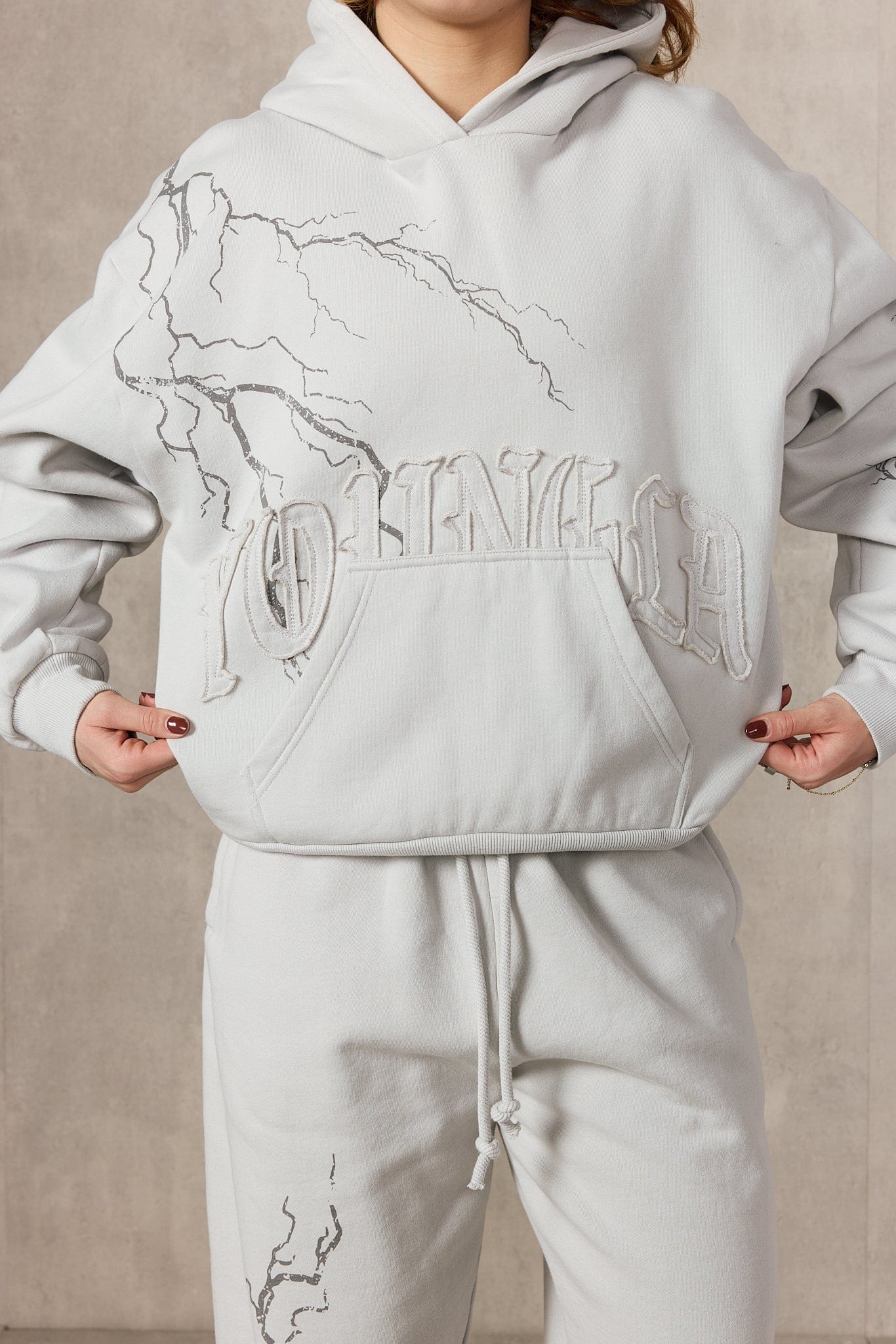 Close-up of the YoungLA oversized hoodies lightning print and zip-up design