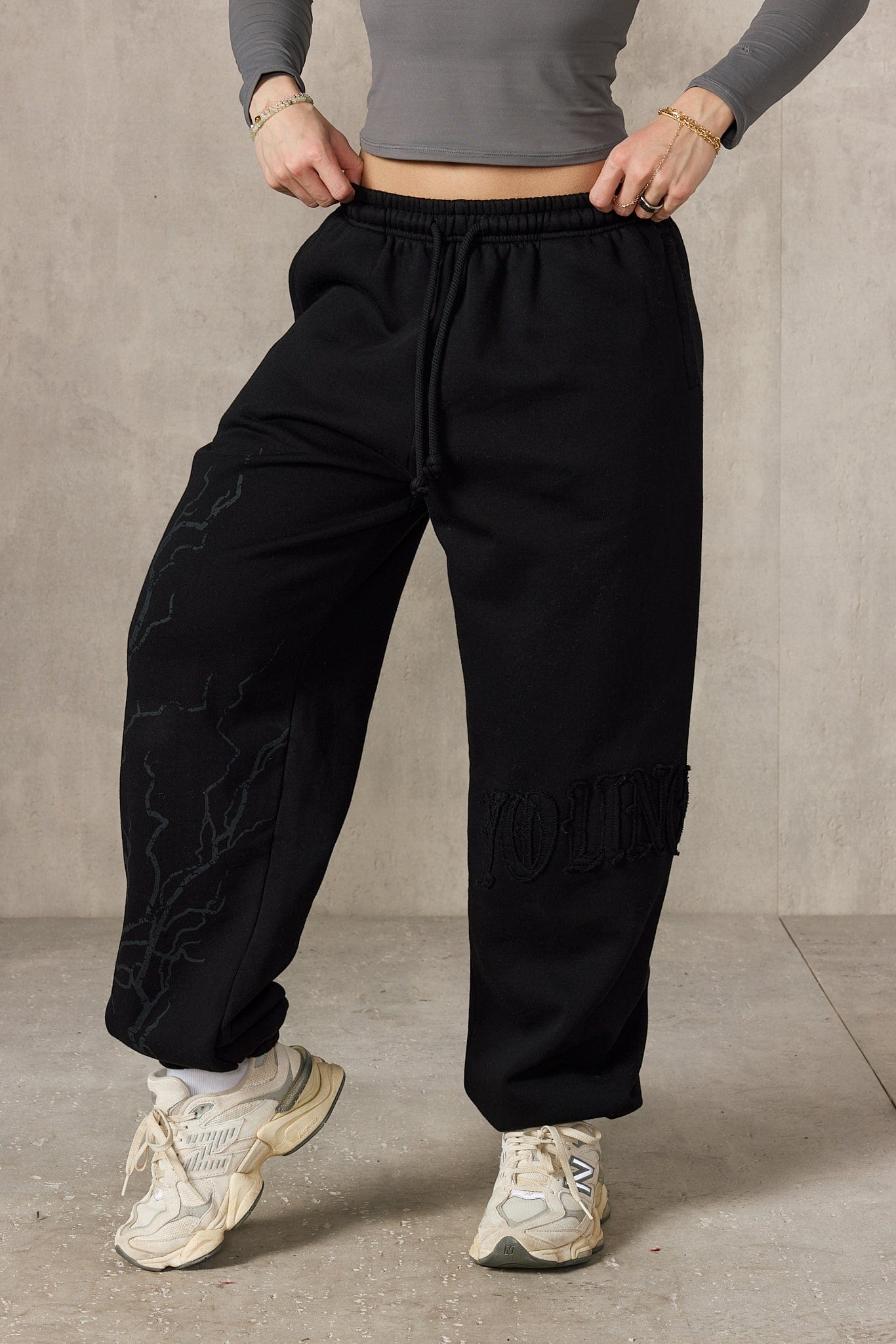 Front view of oversized cuff joggers with lightning design.
