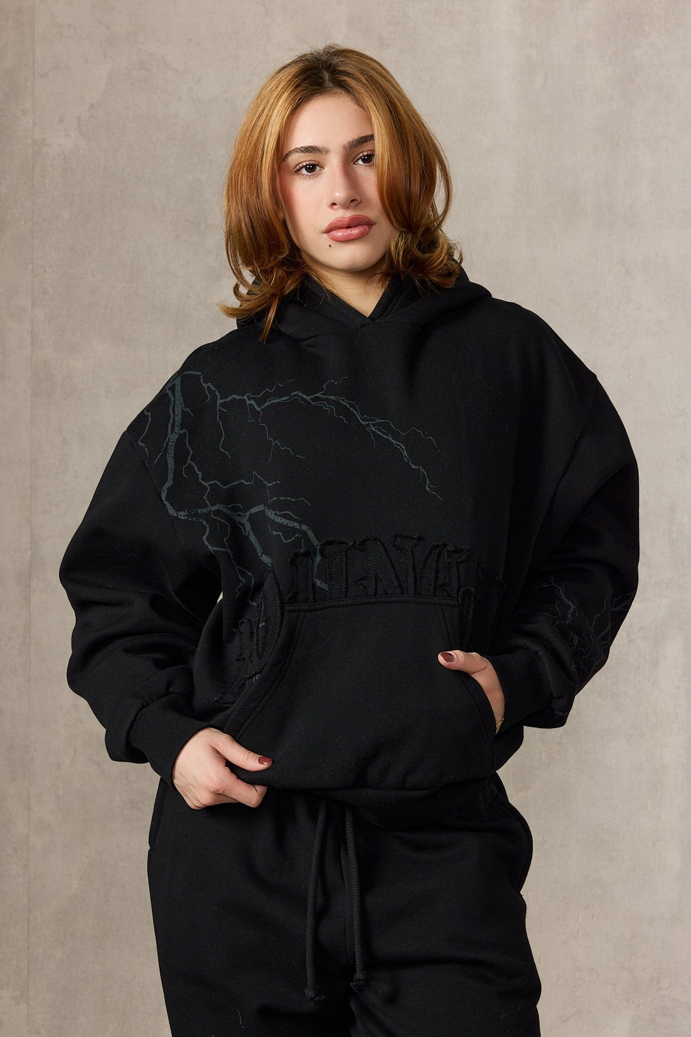 Model wearing the oversized hoodie mens style with joggers for a casual winter look