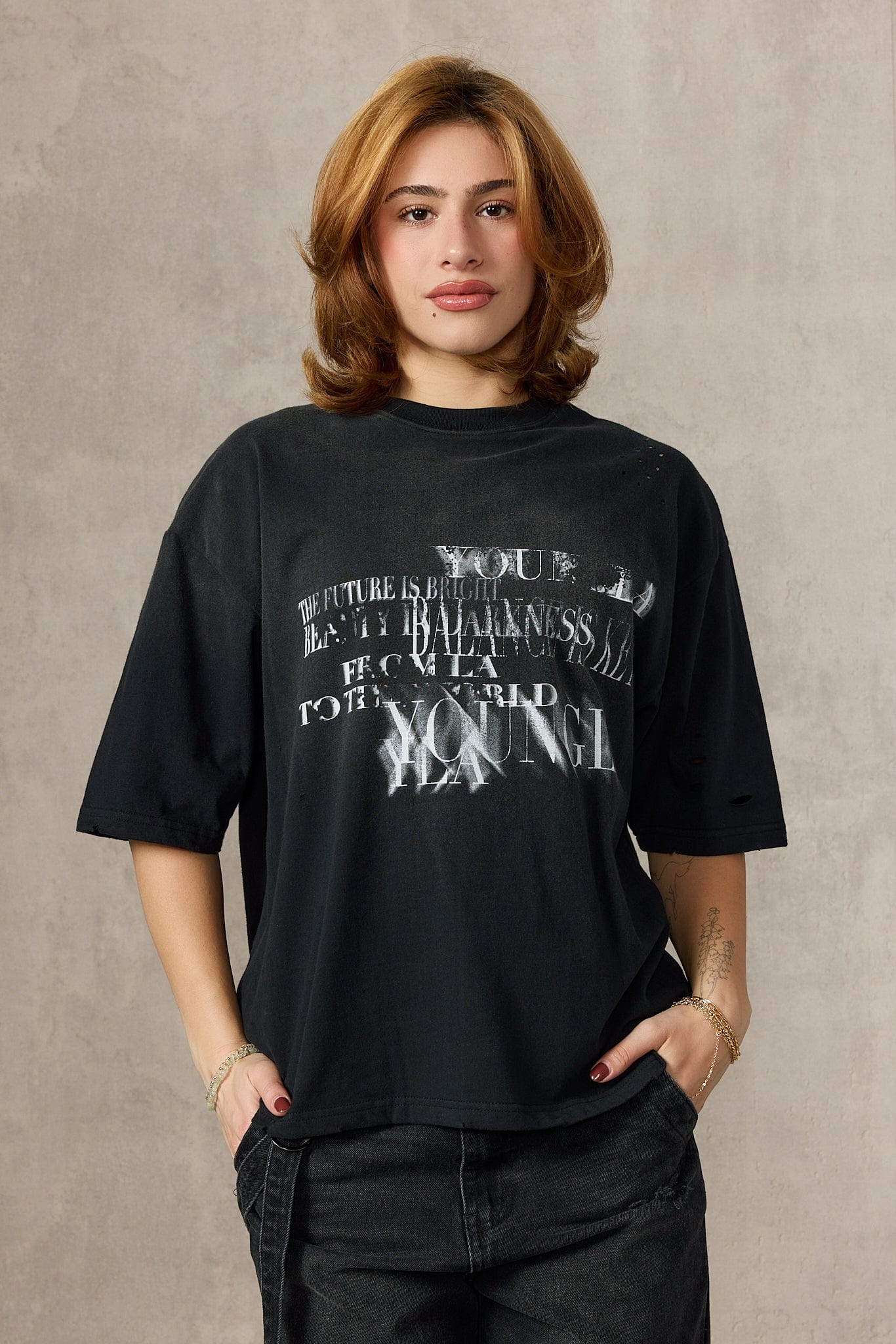 Back view showing full oversized t-shirt design with dropped shoulders