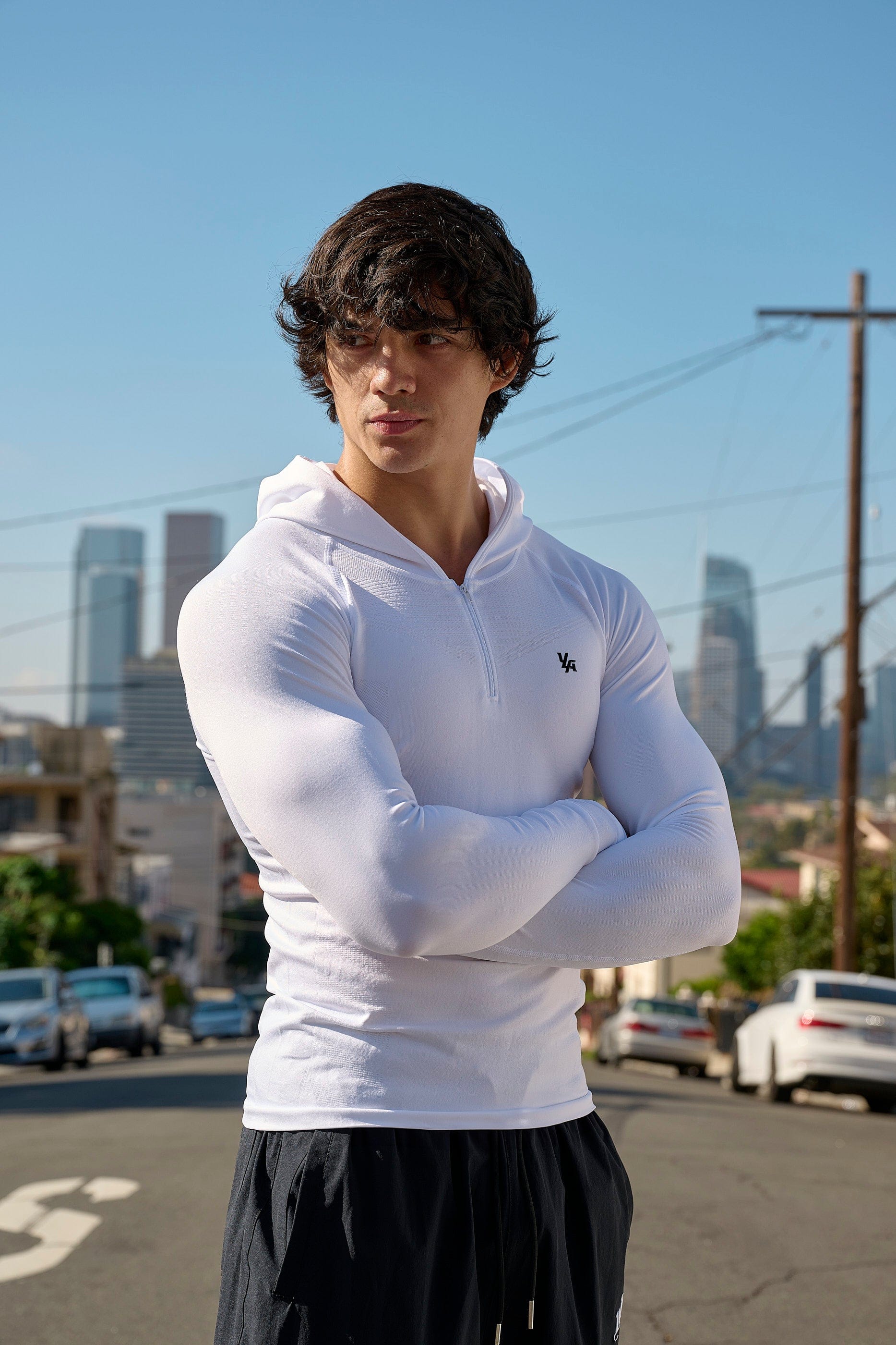 Back profile of no sleeve hoodie workout style showing design contours and brand detailing.