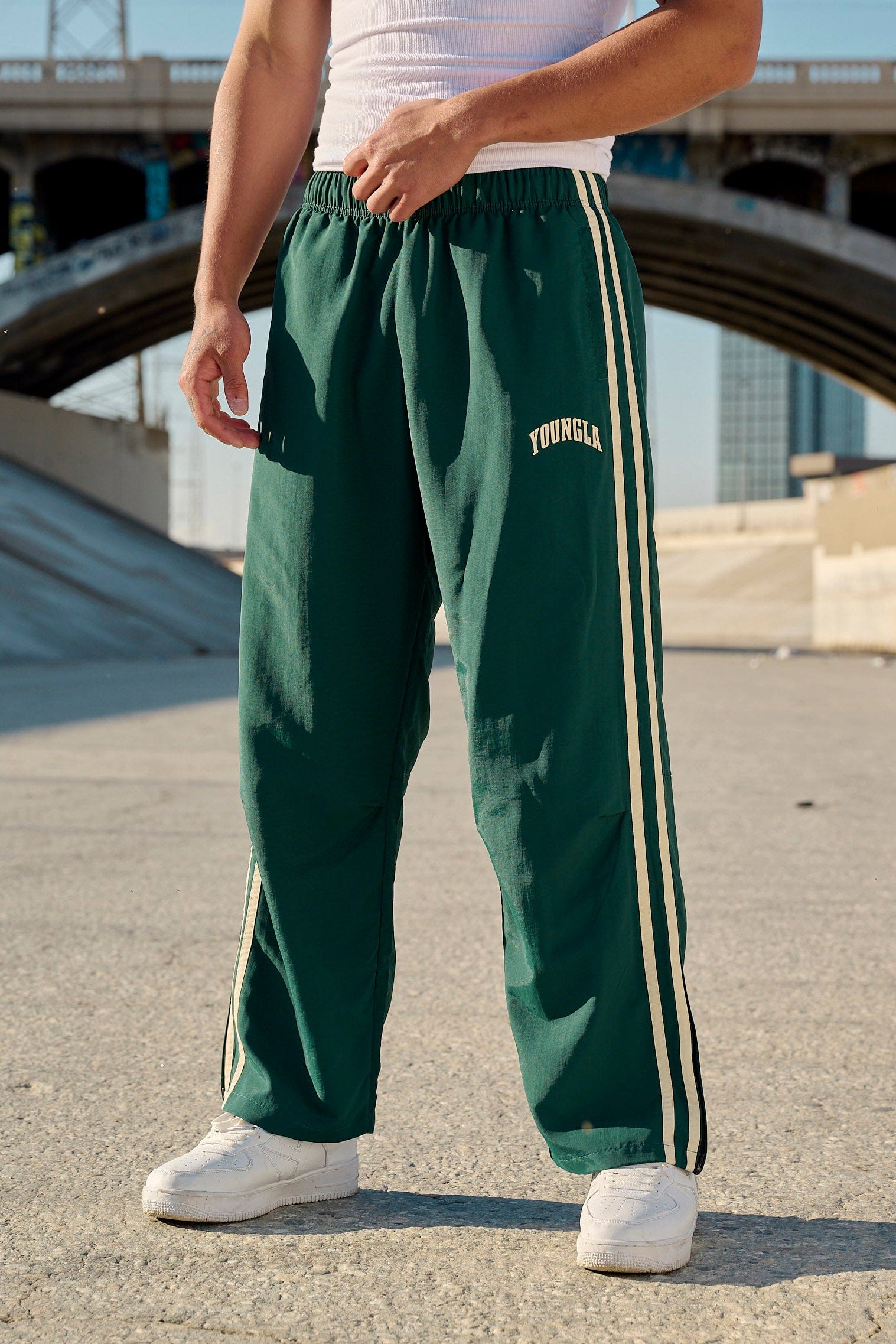 Model wearing black joggers, perfect for casual outings or lounging.