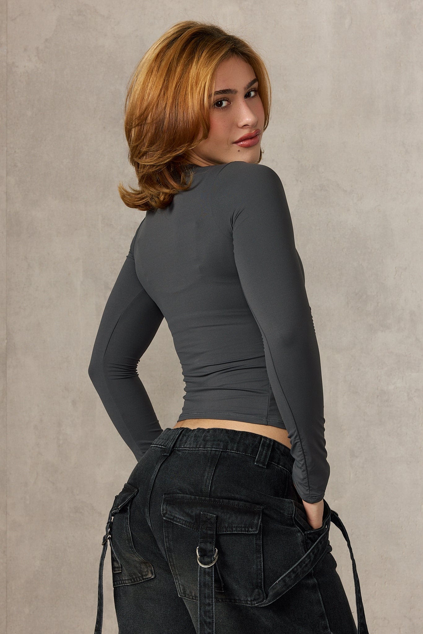 Model wearing W480 Winter Arc Long Sleeve Graphic Tee in navy blue.