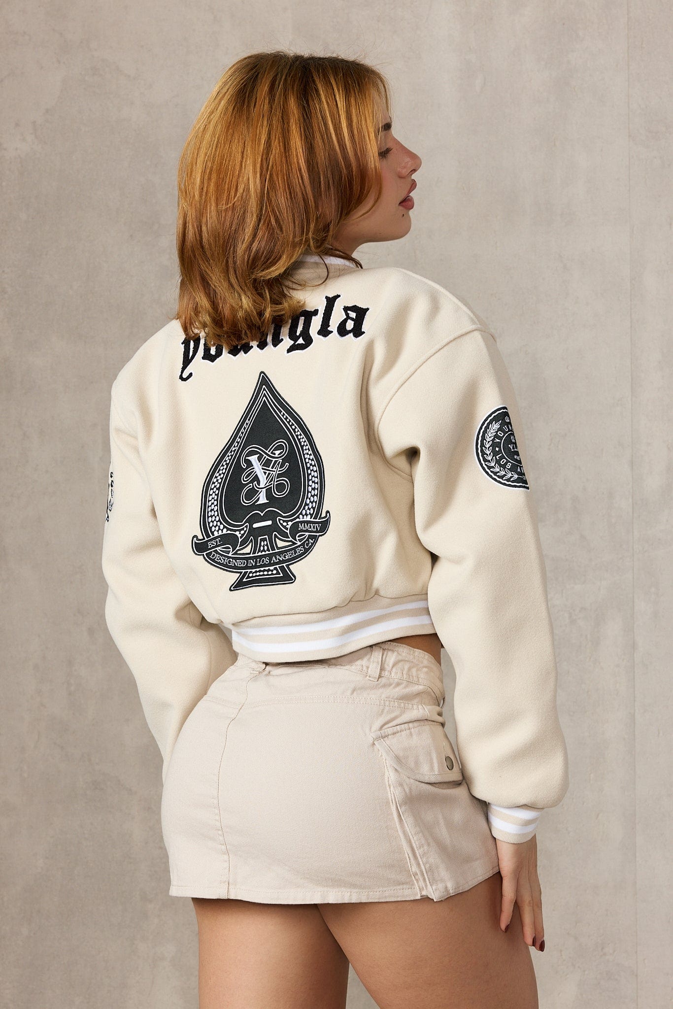 Front view of the Ivy League Cropped Leather Jacket highlighting its cropped length