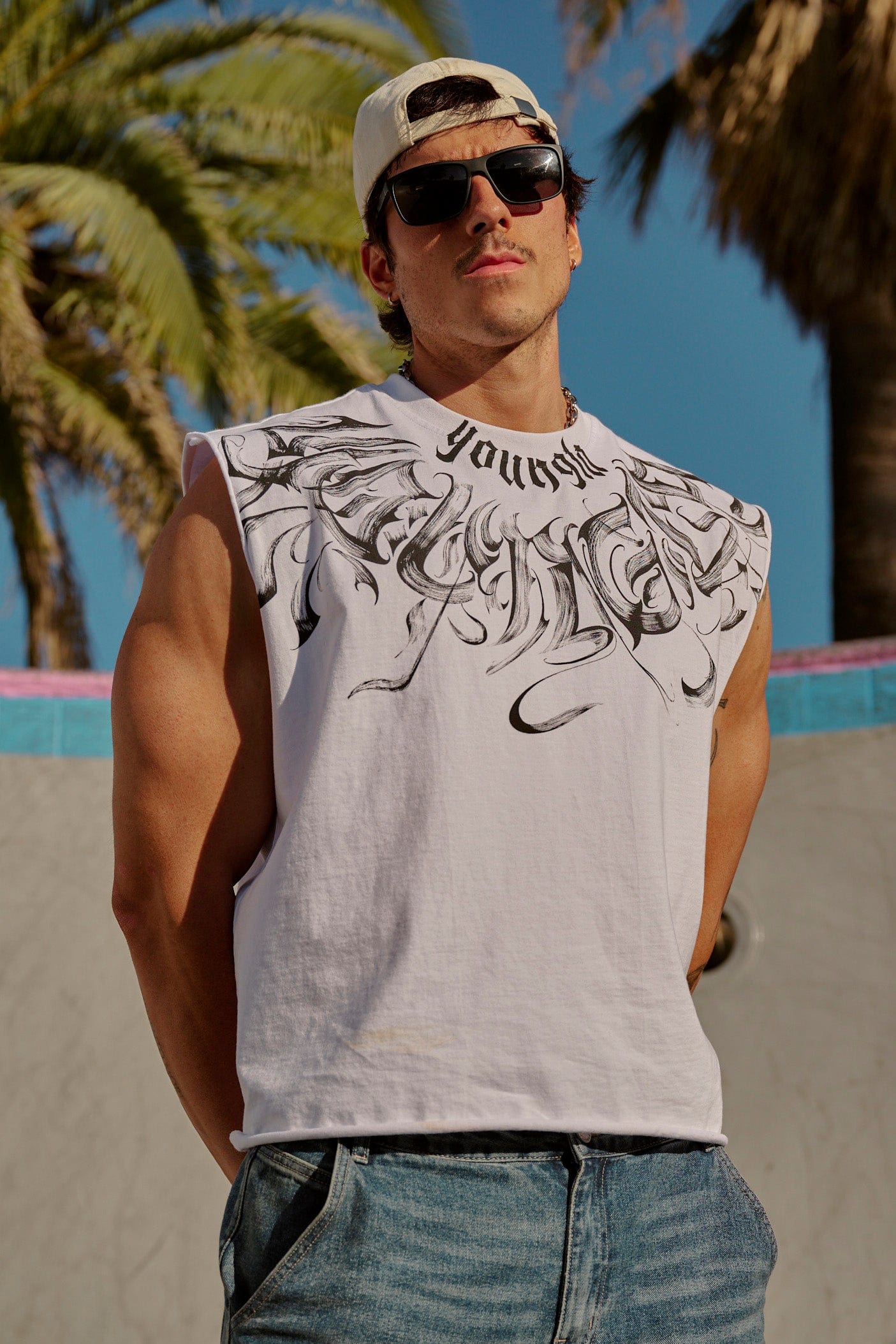 Side angle of YoungLA Mens Gym Shirt highlighting raw-cut sleeves.