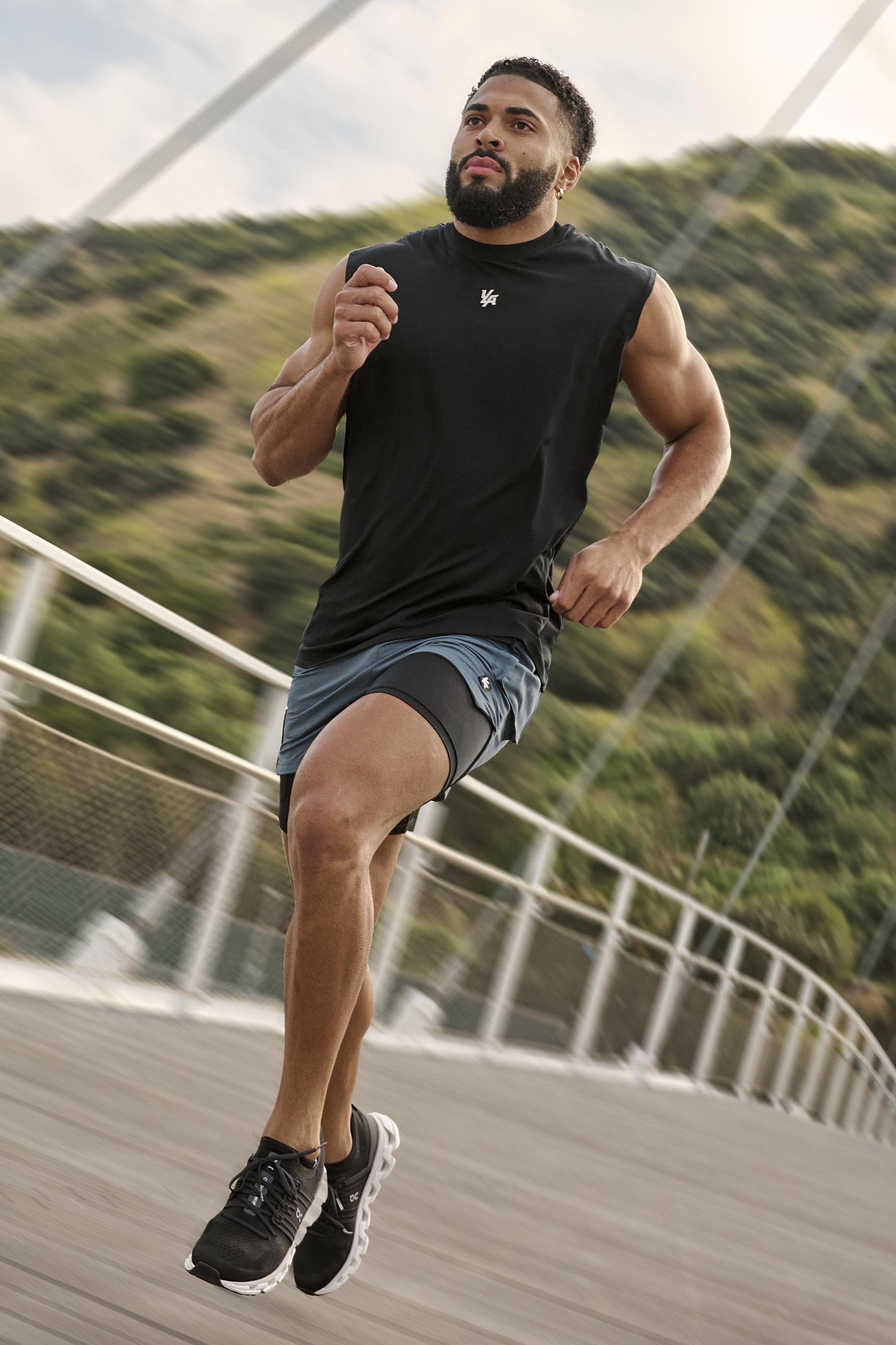 Runner in motion wearing RunTech tank top.