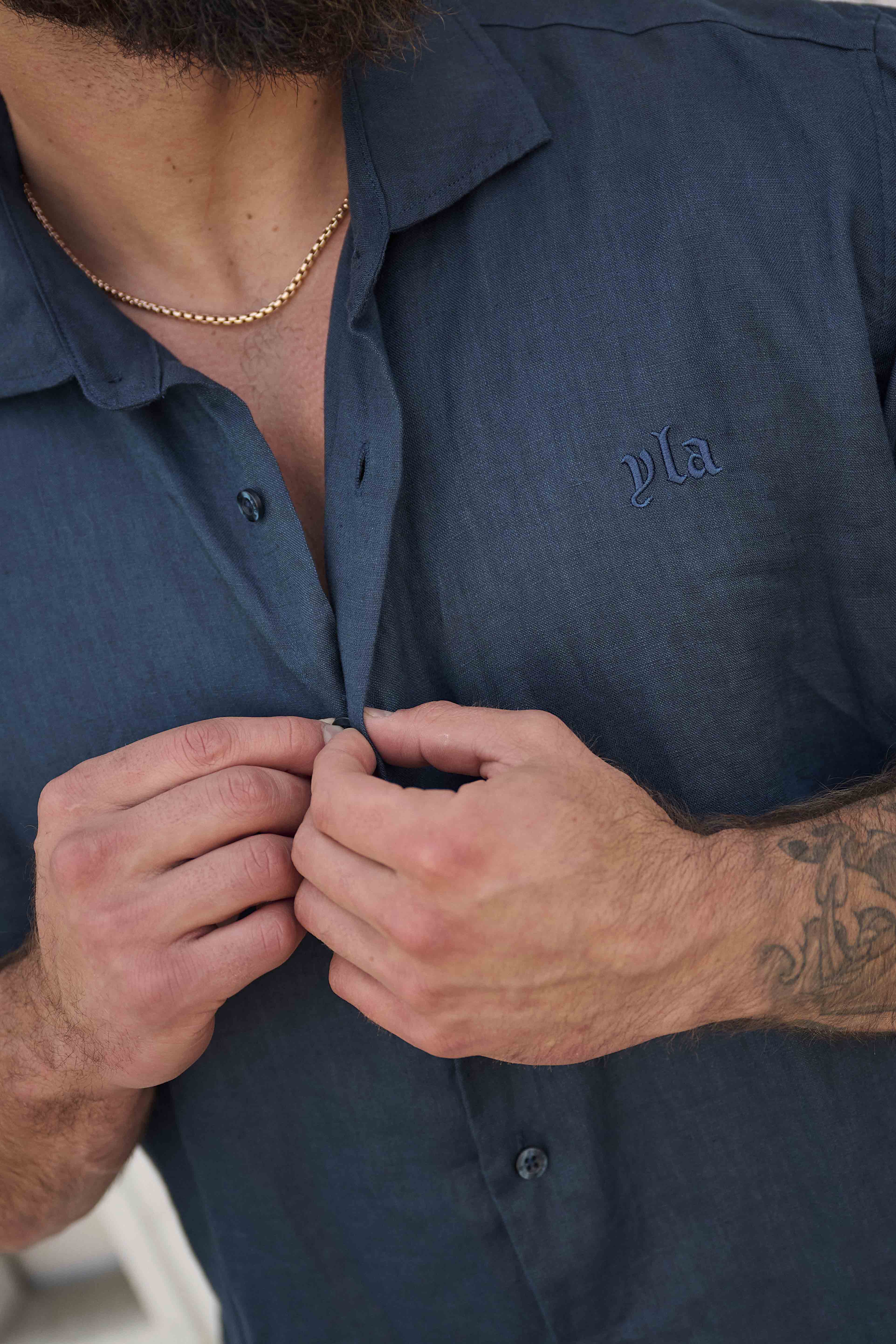 Close-up of linen button down shirt showing textured fabric detail