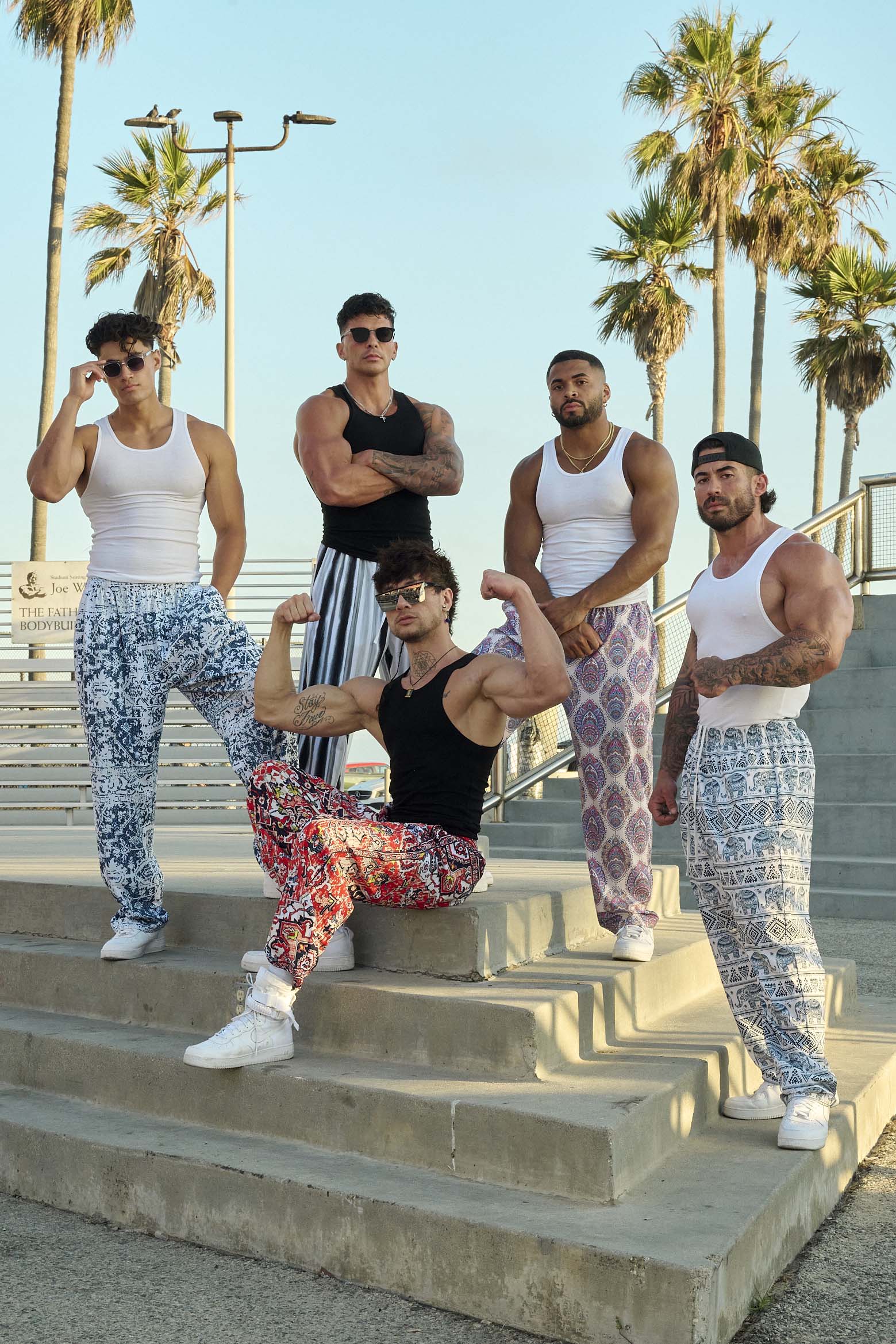 Front view of vintage bodybuilding style loose fit cargo pants with bold print