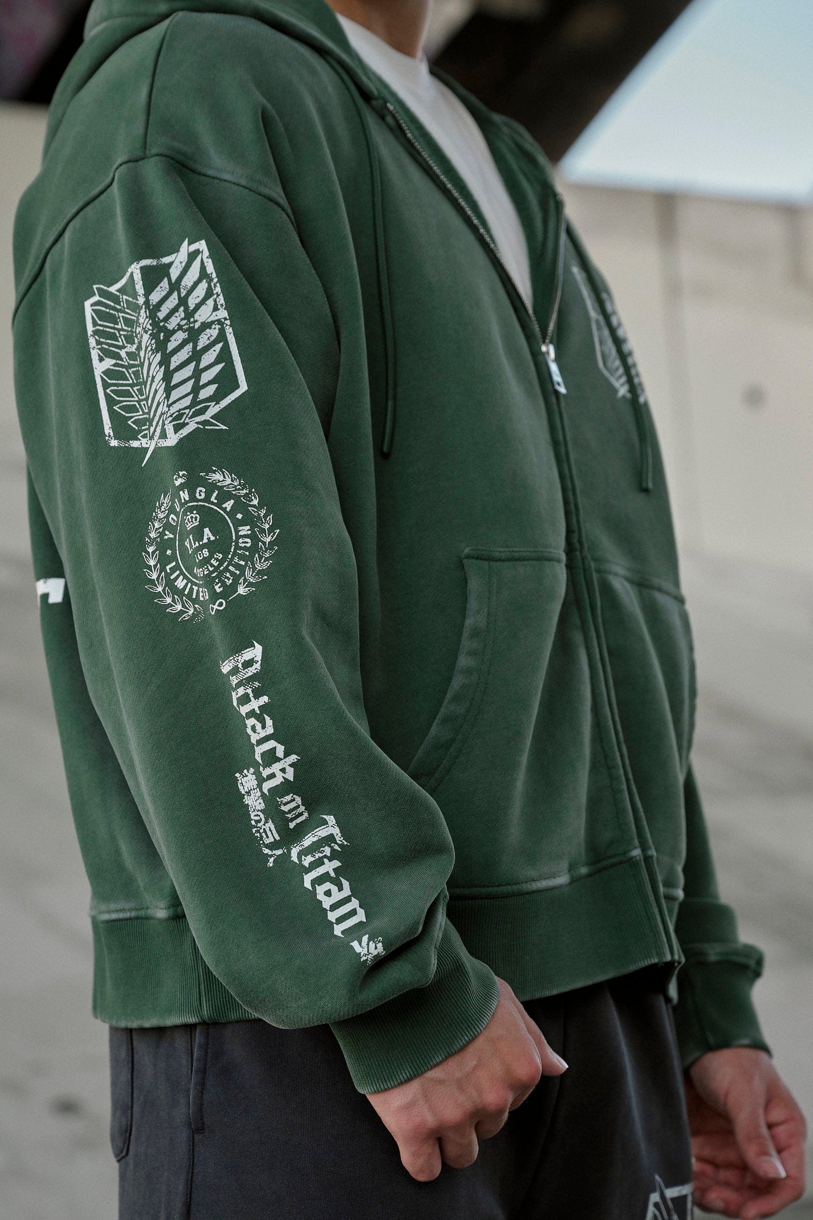 Close-up of attack on titan hoodie with graphics on back and sleeves