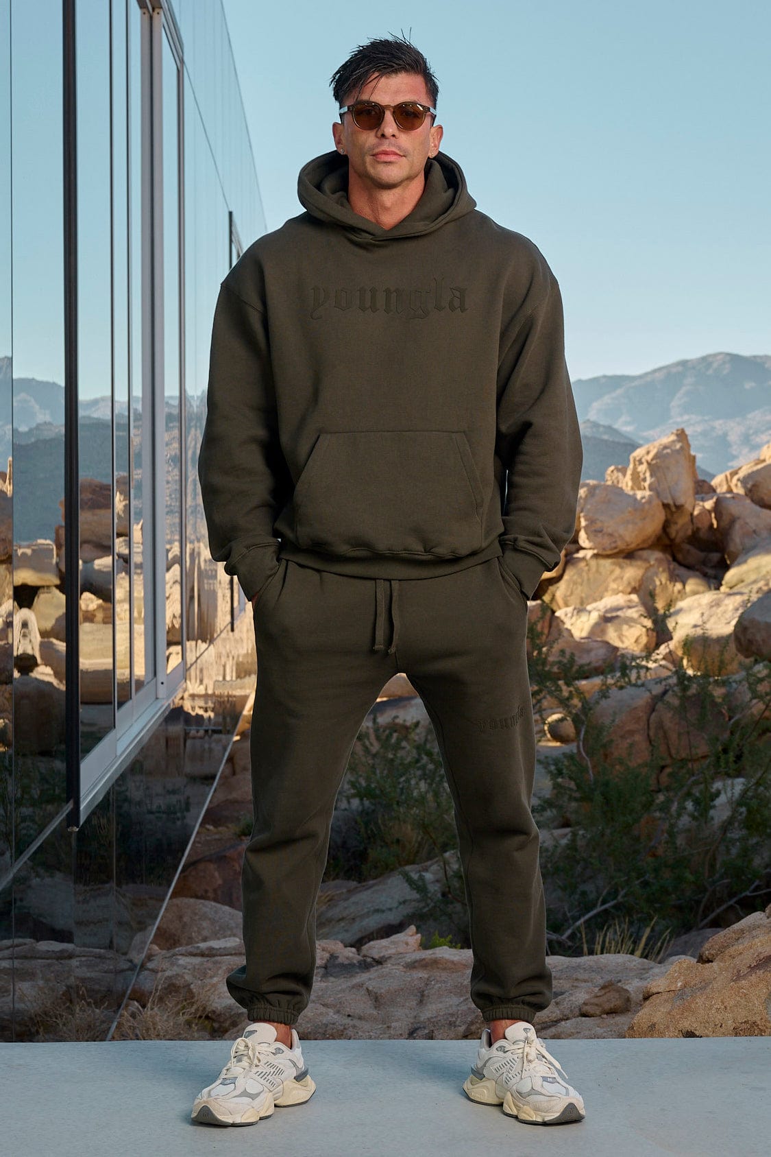 Side angle of mens UA Rival fleece joggers perfect for casual outings.