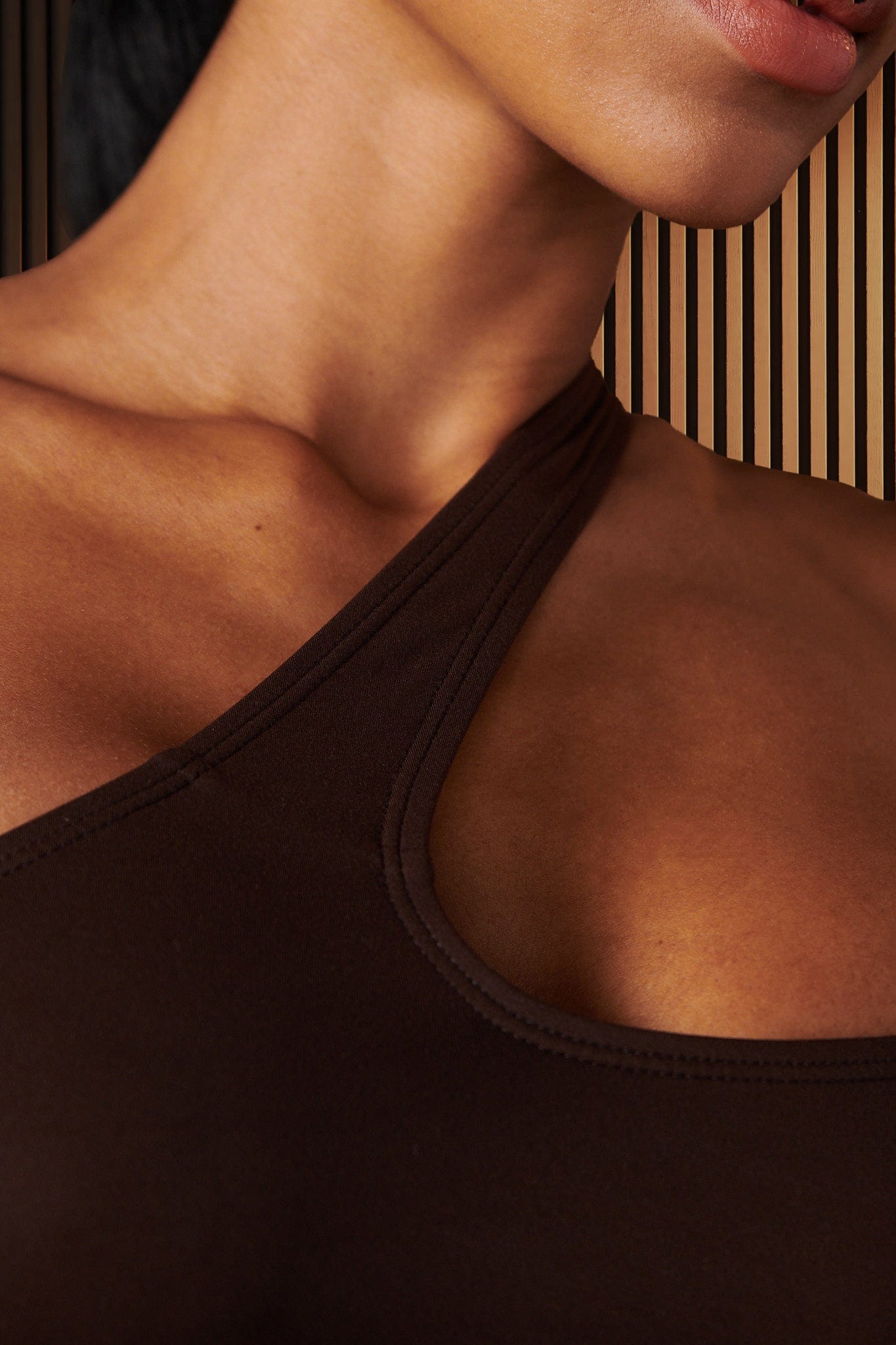 Back angle of the alo sports bra styled for a casual outdoor walk