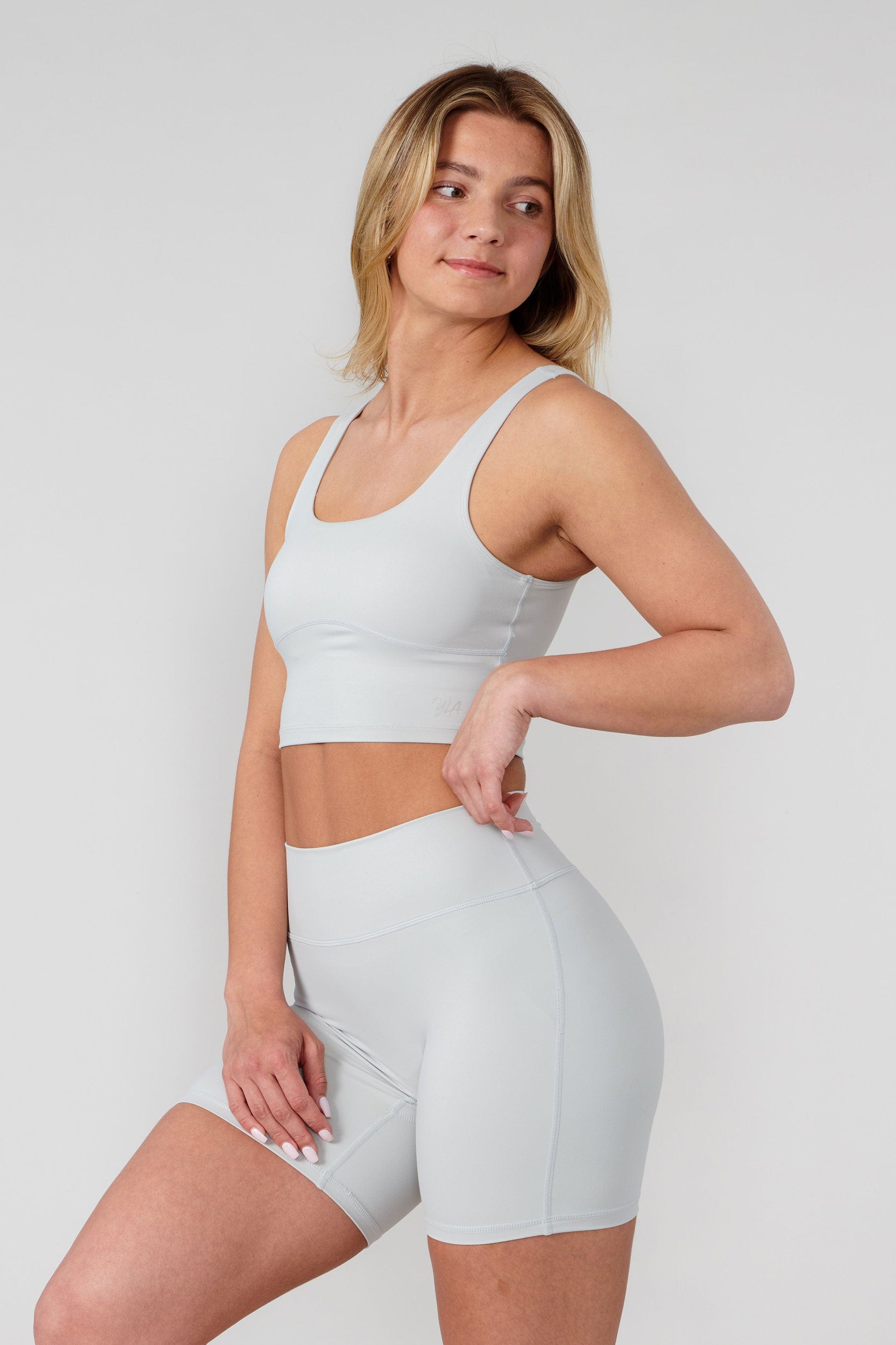 Front fit view highlighting no front seam on womens bike shorts in matte black.