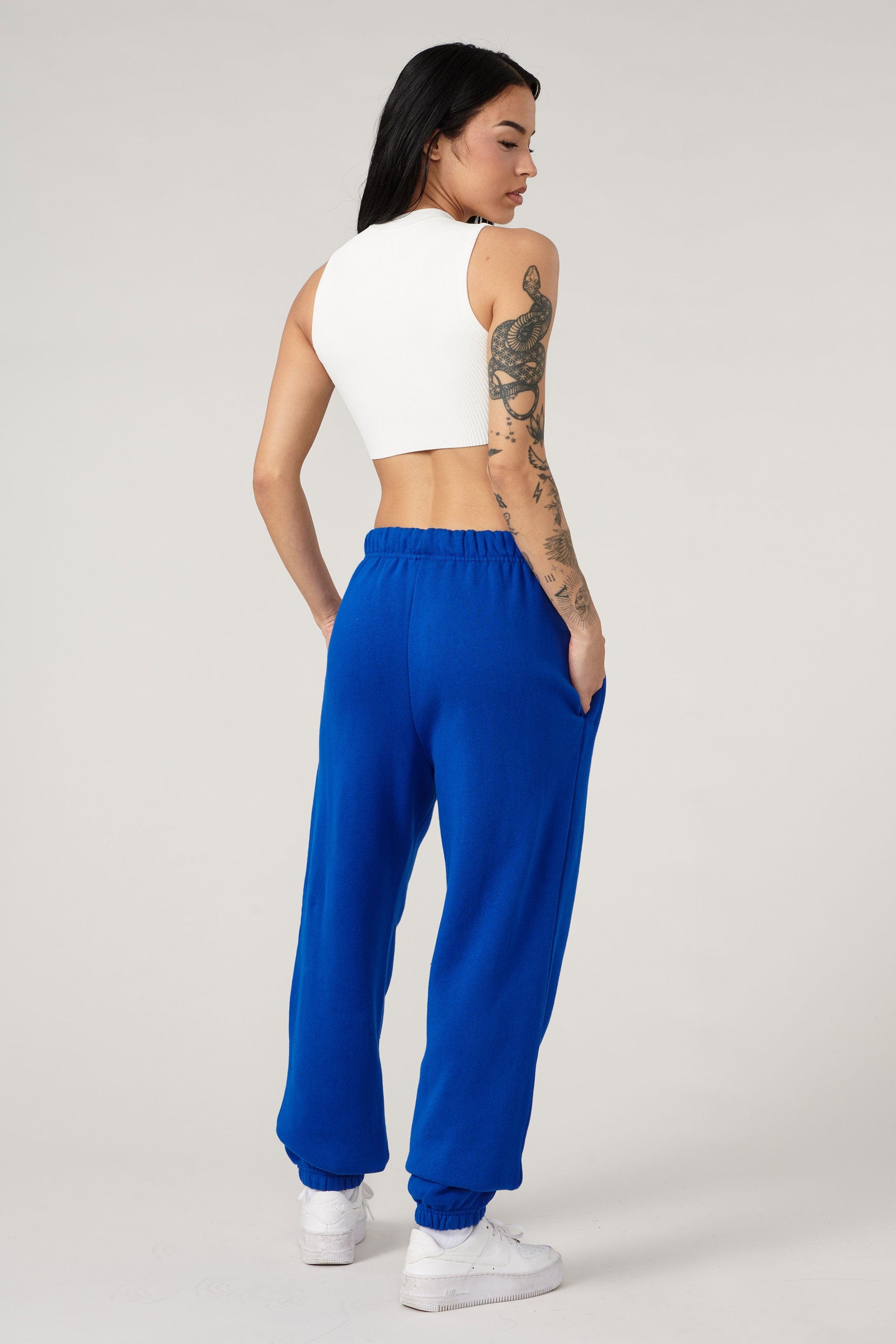 Front view of model in organic cotton joggers, perfect for athleisure wear.
