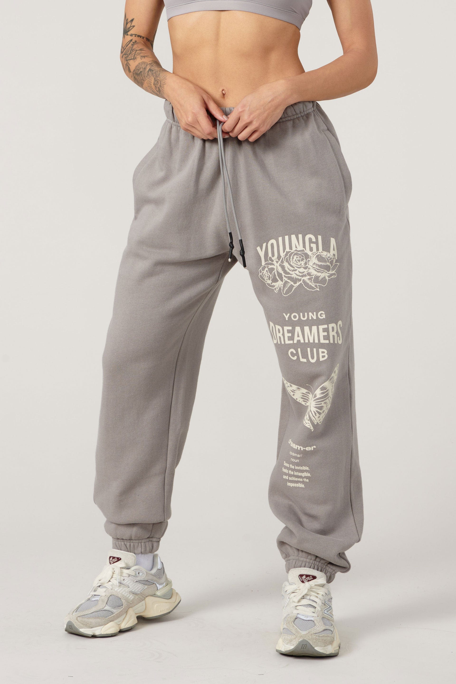 Front view of model in organic cotton joggers, perfect for athleisure wear.